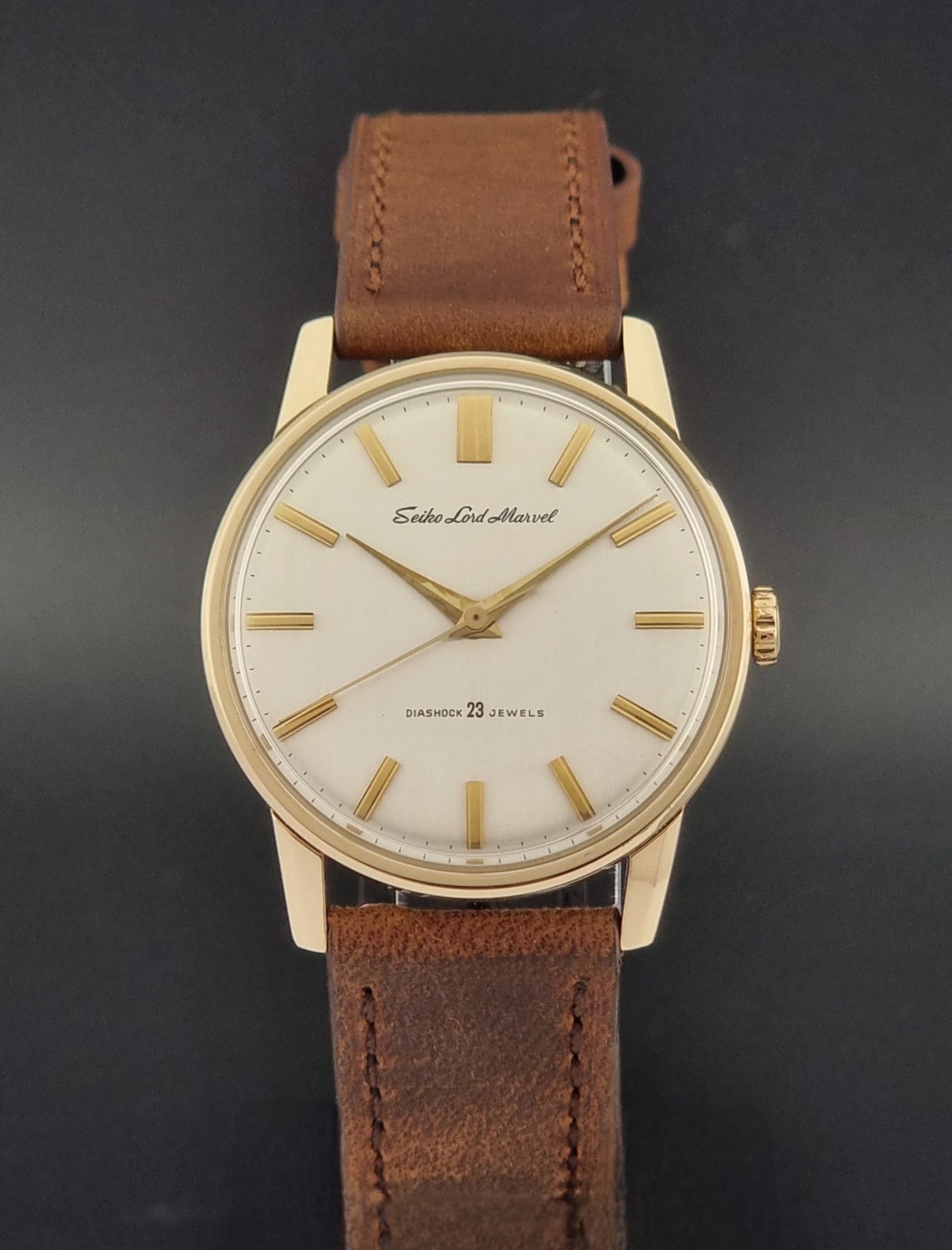 Vintage Seiko Lord Marvel 5740-1991 gold filled watch on a dark background close dial view