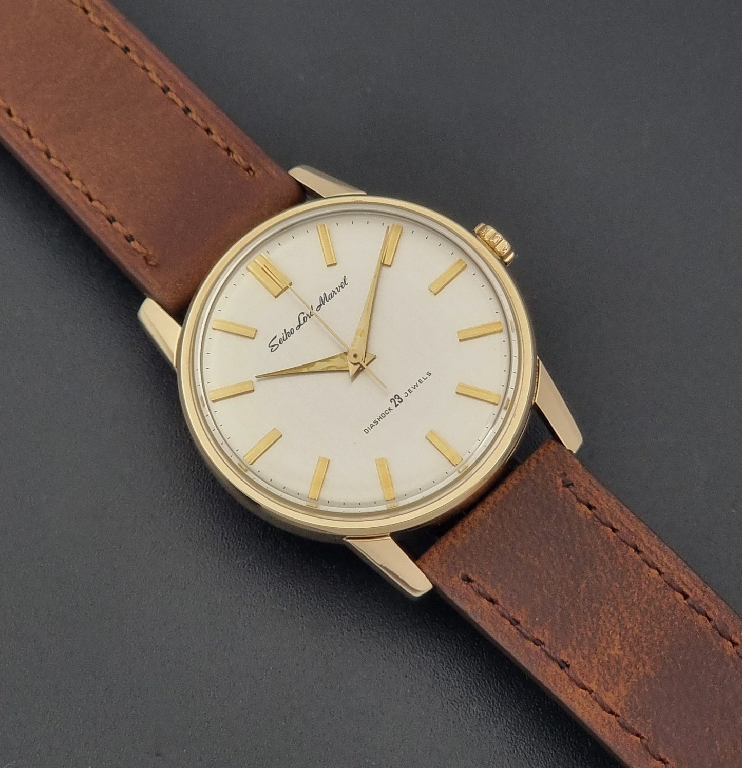 Vintage Seiko Lord Marvel 5740-1991 gold filled watch on a dark background close up dial view