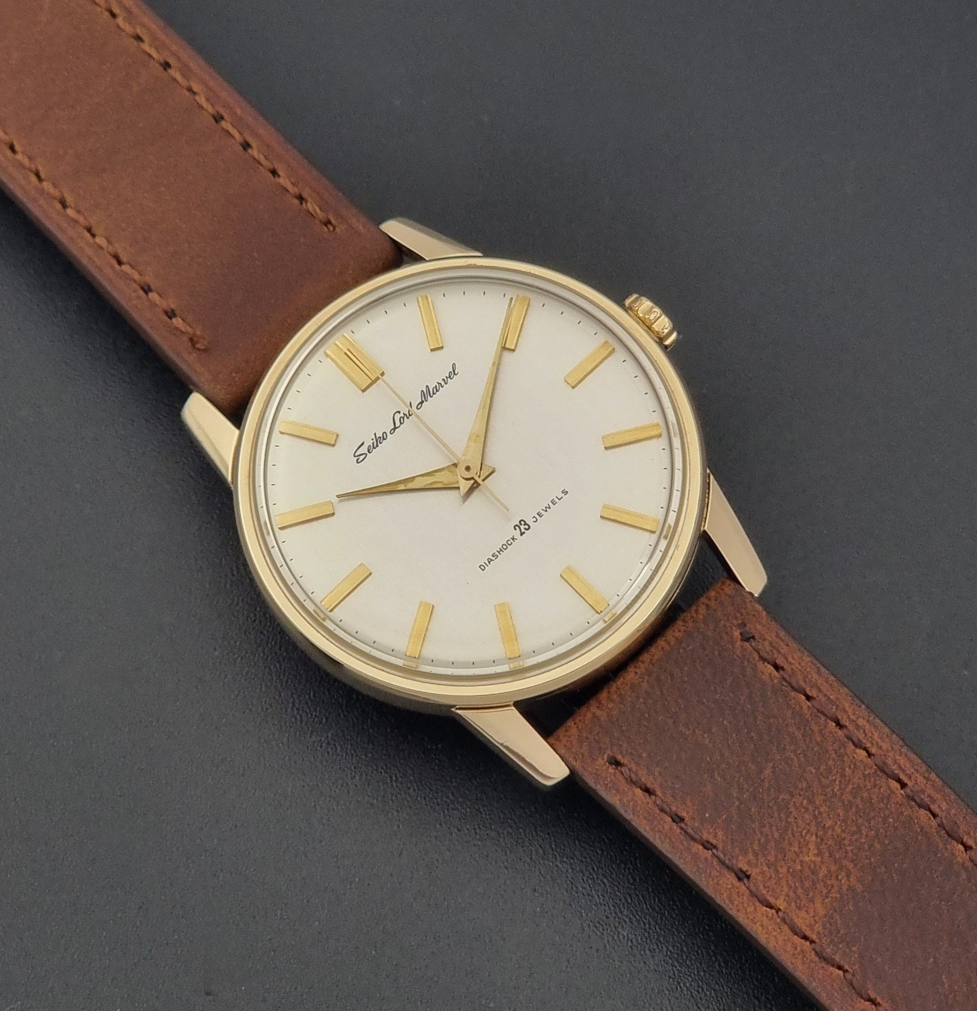 Vintage Seiko Lord Marvel 5740-1991 gold filled watch on a dark background close up dial view