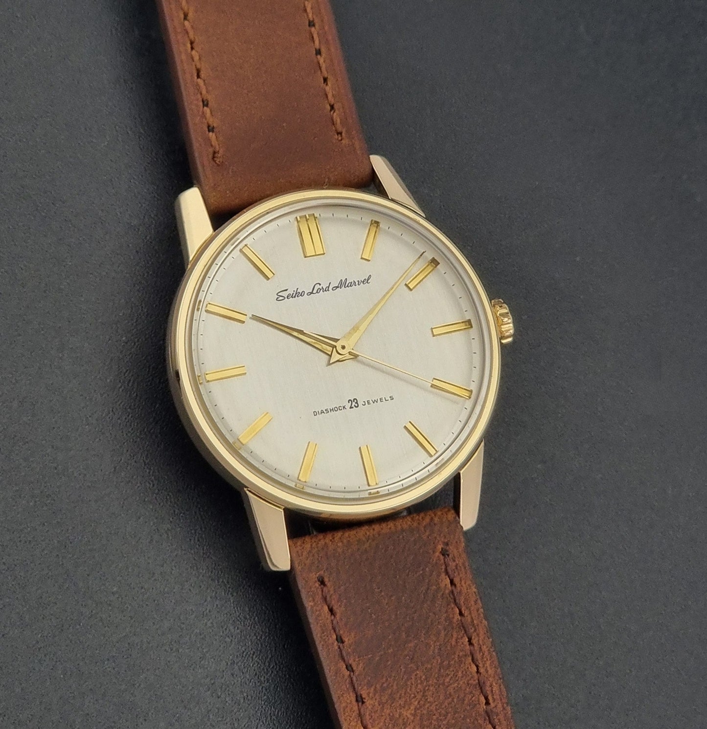 Vintage Seiko Lord Marvel 5740-1991 gold filled watch on a dark background front view