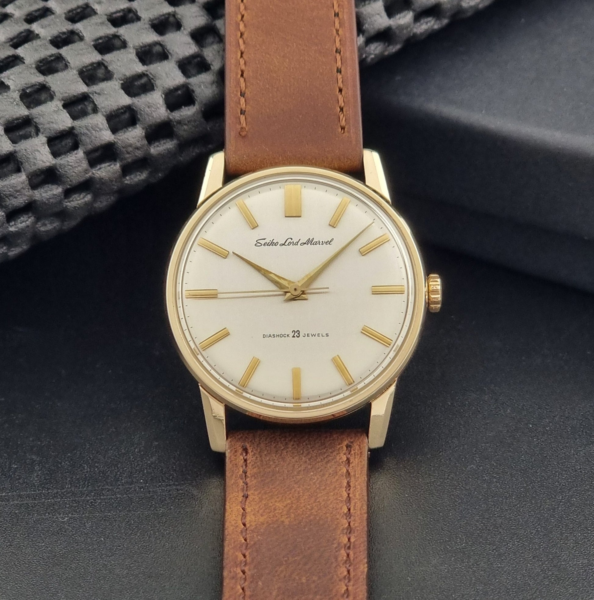 Vintage Seiko Lord Marvel 5740-1991 gold filled watch on a dark background dial view