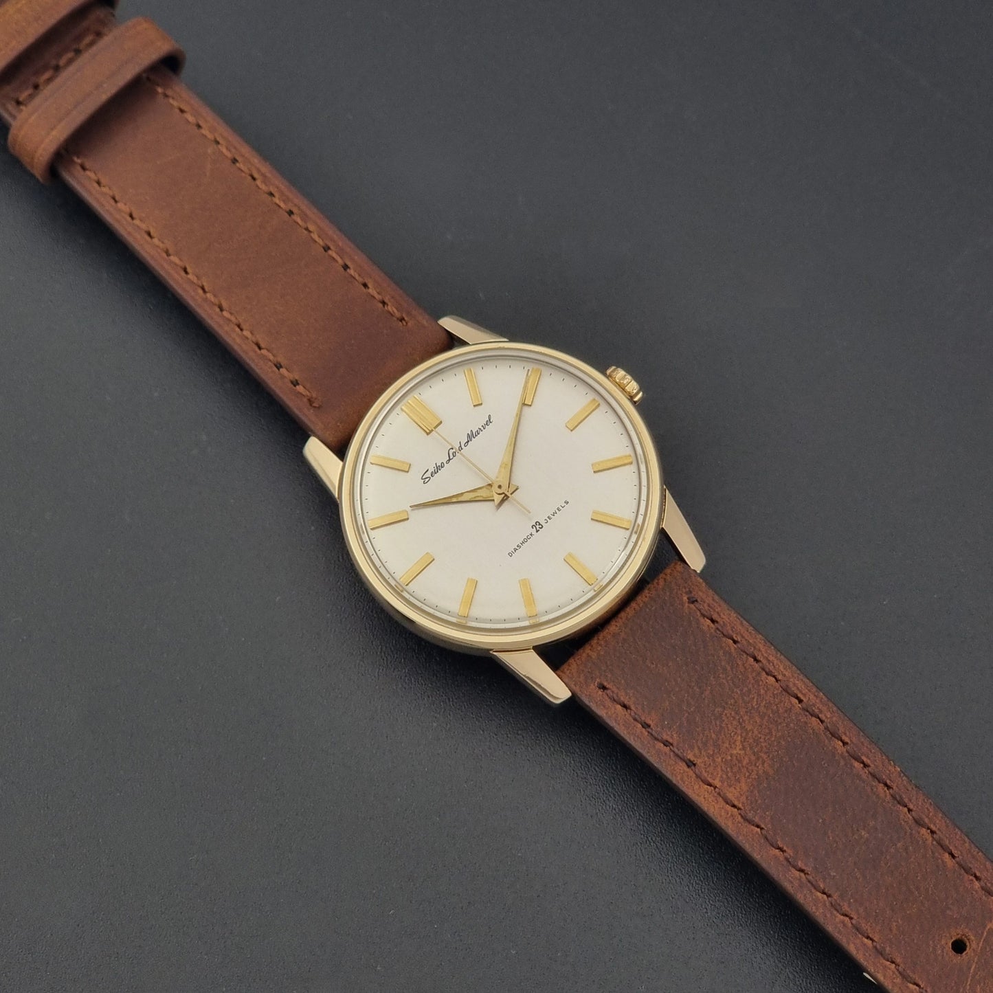 Vintage Seiko Lord Marvel 5740-1991 gold filled watch on a dark background dial