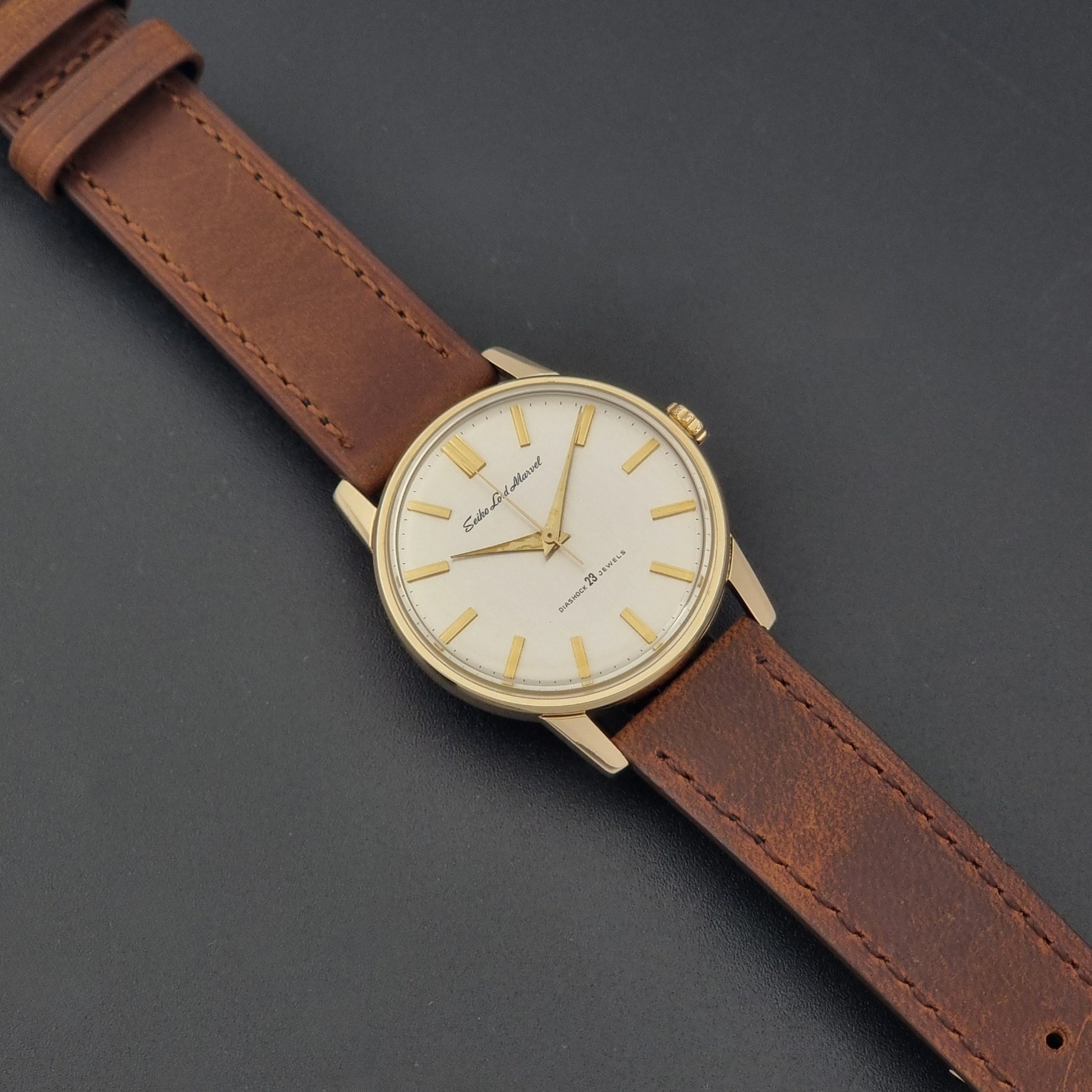 Vintage Seiko Lord Marvel 5740-1991 gold filled watch on a dark background dial