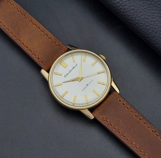 Vintage Seiko watch Lord Marvel 5740-1991 with brown leather strap and gold casing on a dark grey background dial