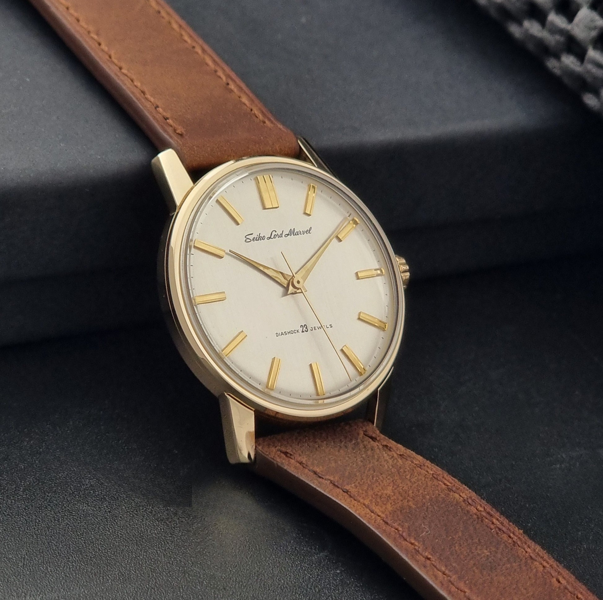 Vintage Seiko Lord Marvel 5740-1991 gold filled watch on a dark background side view