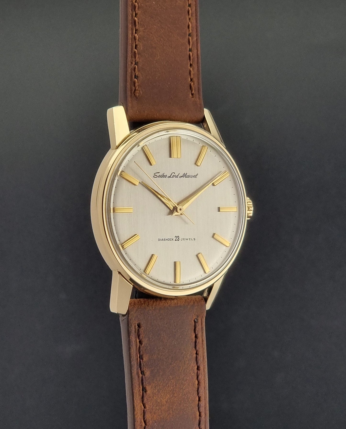 Vintage Seiko Lord Marvel 5740-1991 gold filled watch on a dark background side profile view