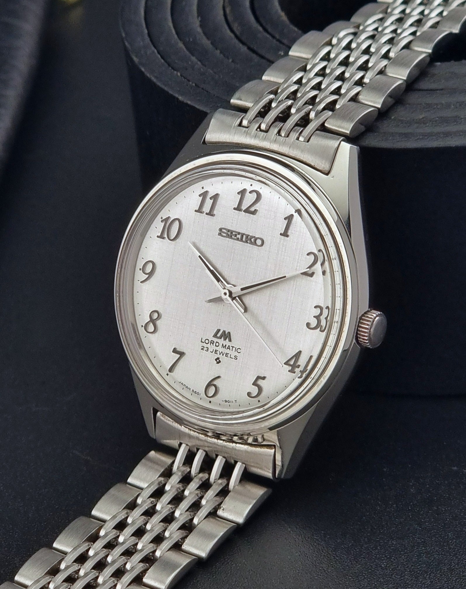Seiko Lord Matic watch with a white face on a dark background