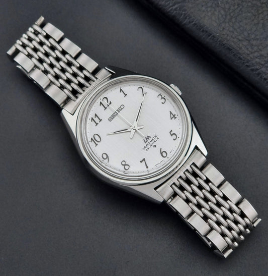 Vintage Seiko Wristwatch LordMatic 5601-9000 on a dark gray background dial