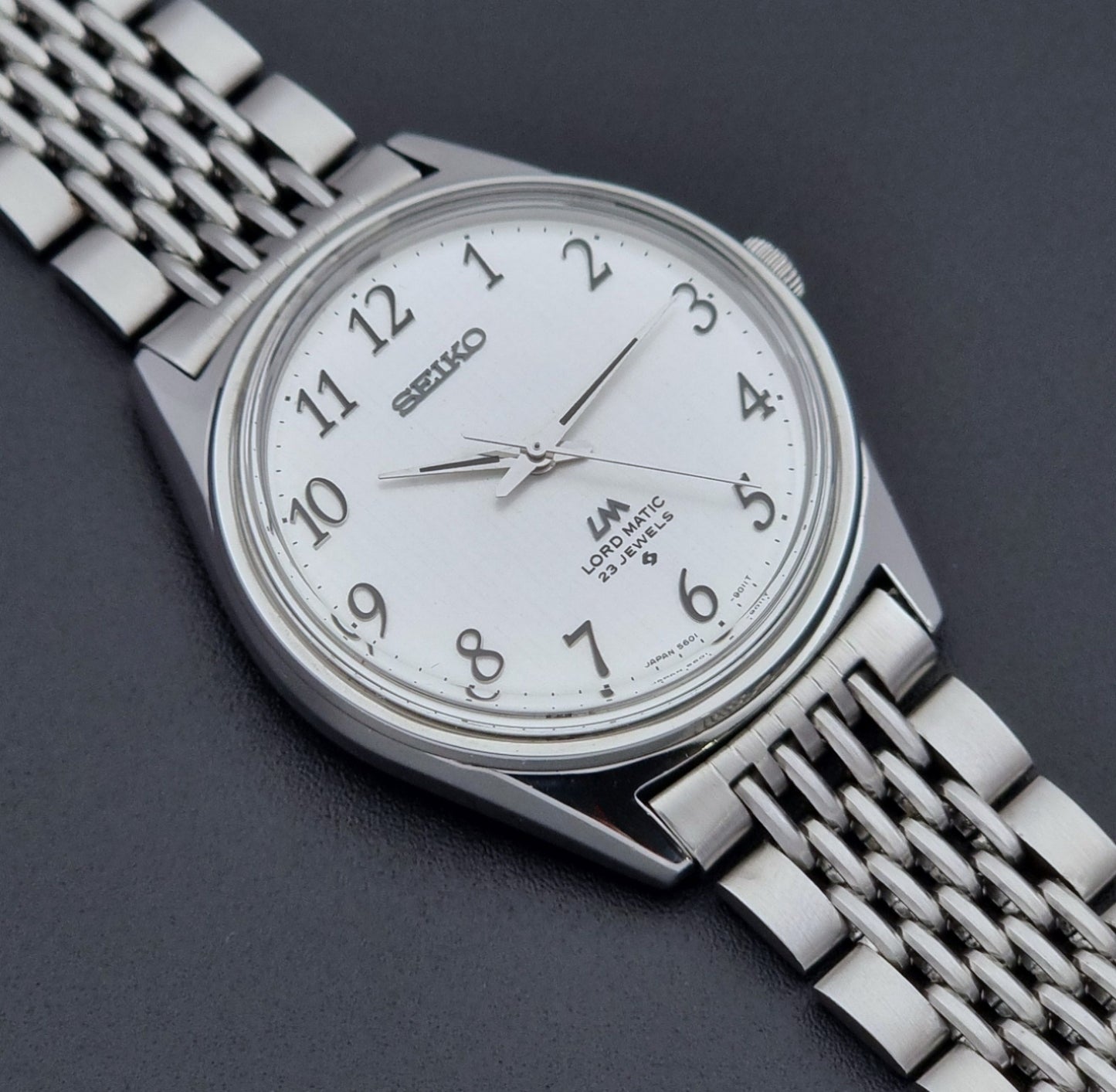 Vintage Seiko watch LordMatic 5601-9000  on a dark background dial close up