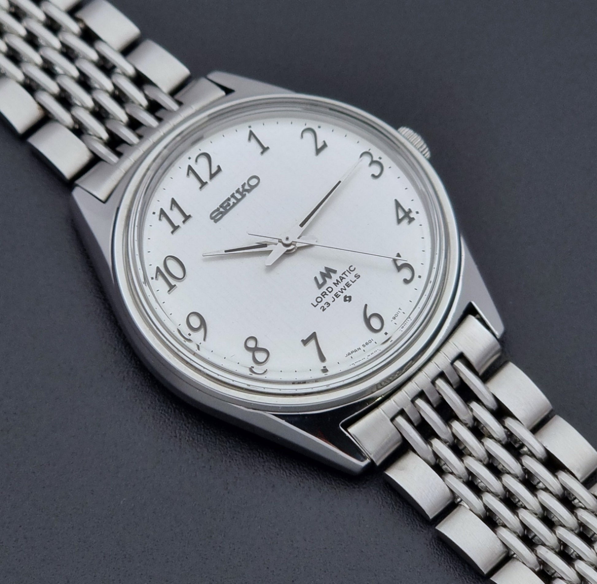 Vintage Seiko watch LordMatic 5601-9000  on a dark background dial close up