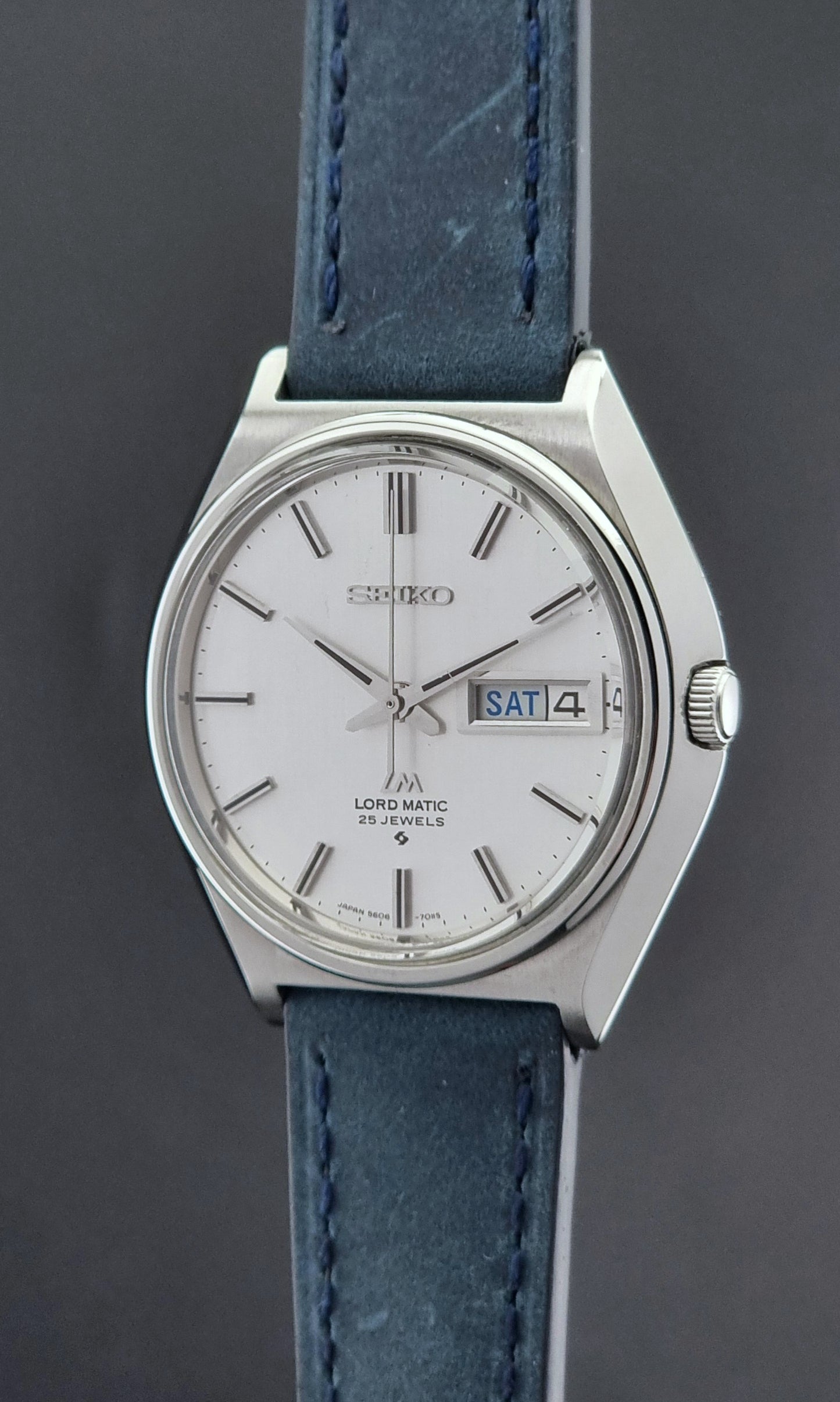 Vintage Seiko Wristwatch LordMatic 5606-7010 on a blue strap