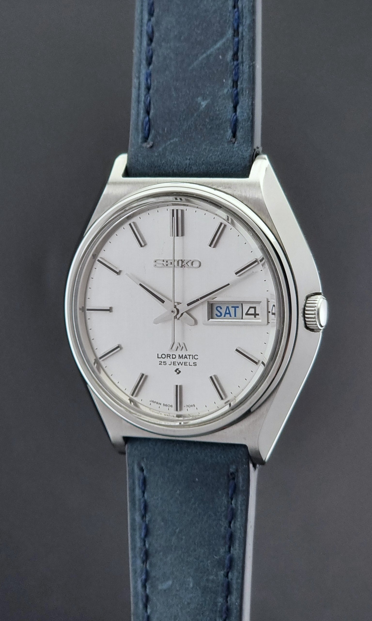 Vintage Seiko Wristwatch LordMatic 5606-7010 on a blue strap