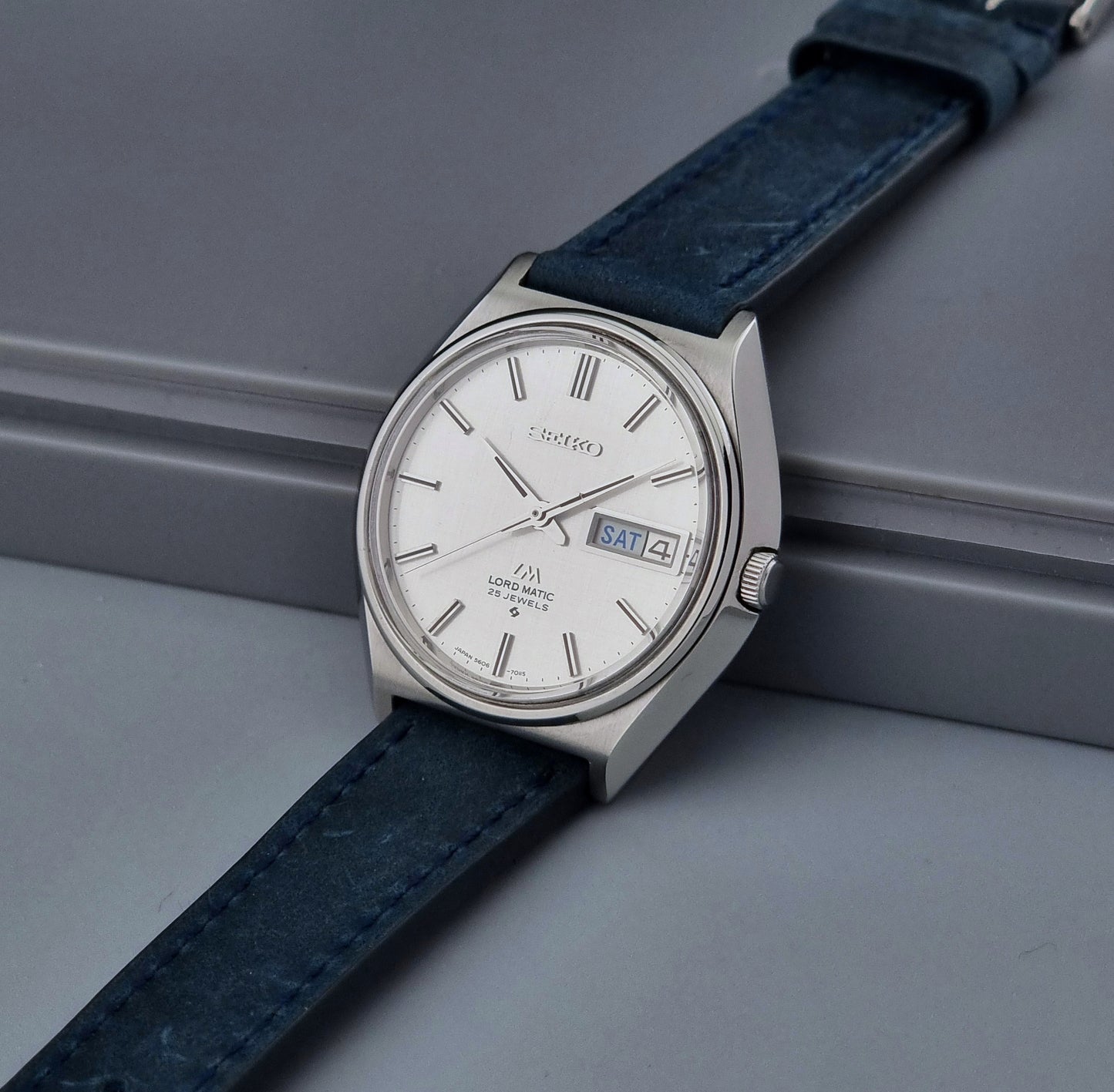 Vintage Seiko Wristwatch LordMatic 5606-7010 on a blue strap
