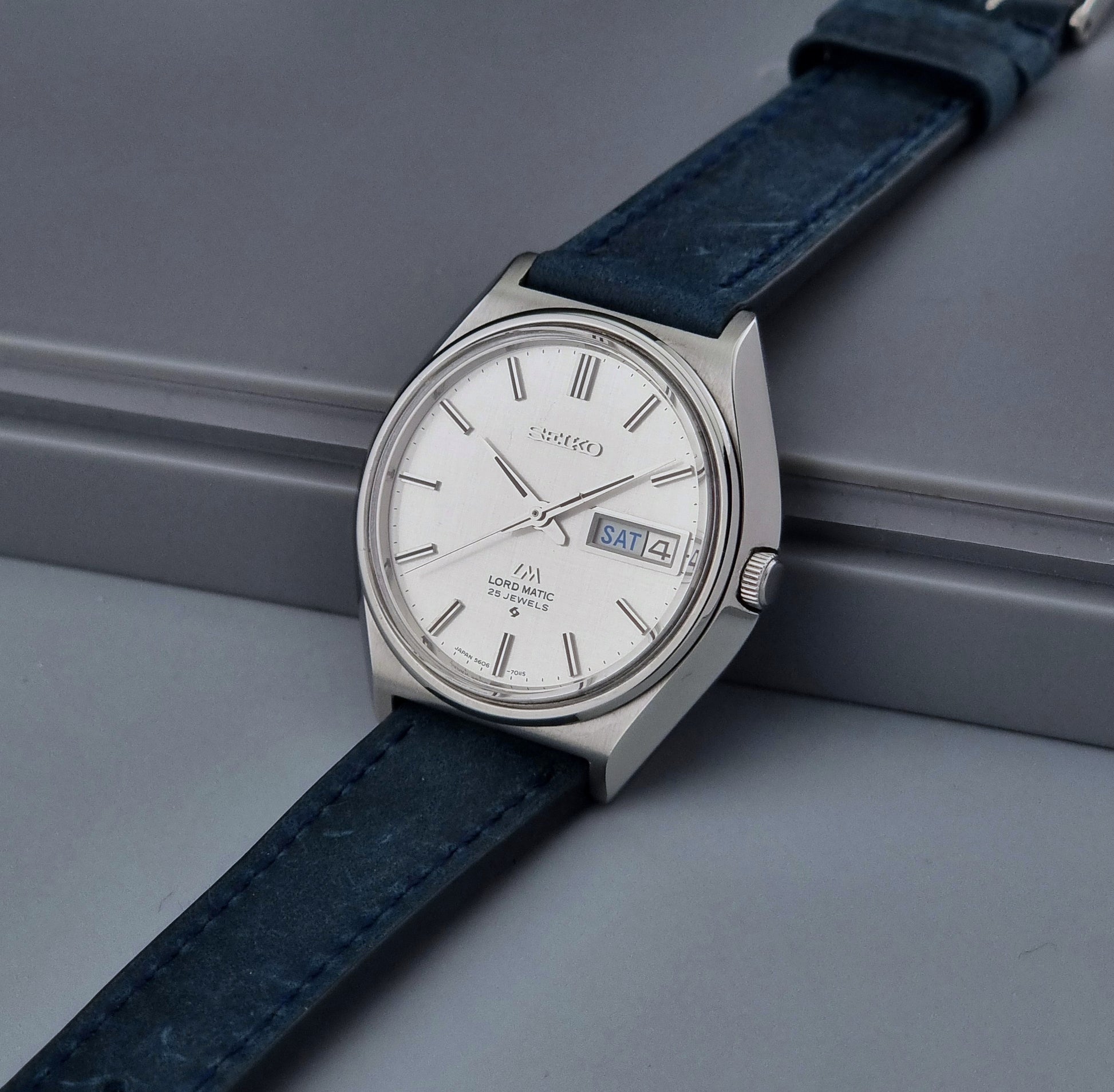 Vintage Seiko Wristwatch LordMatic 5606-7010 on a blue strap