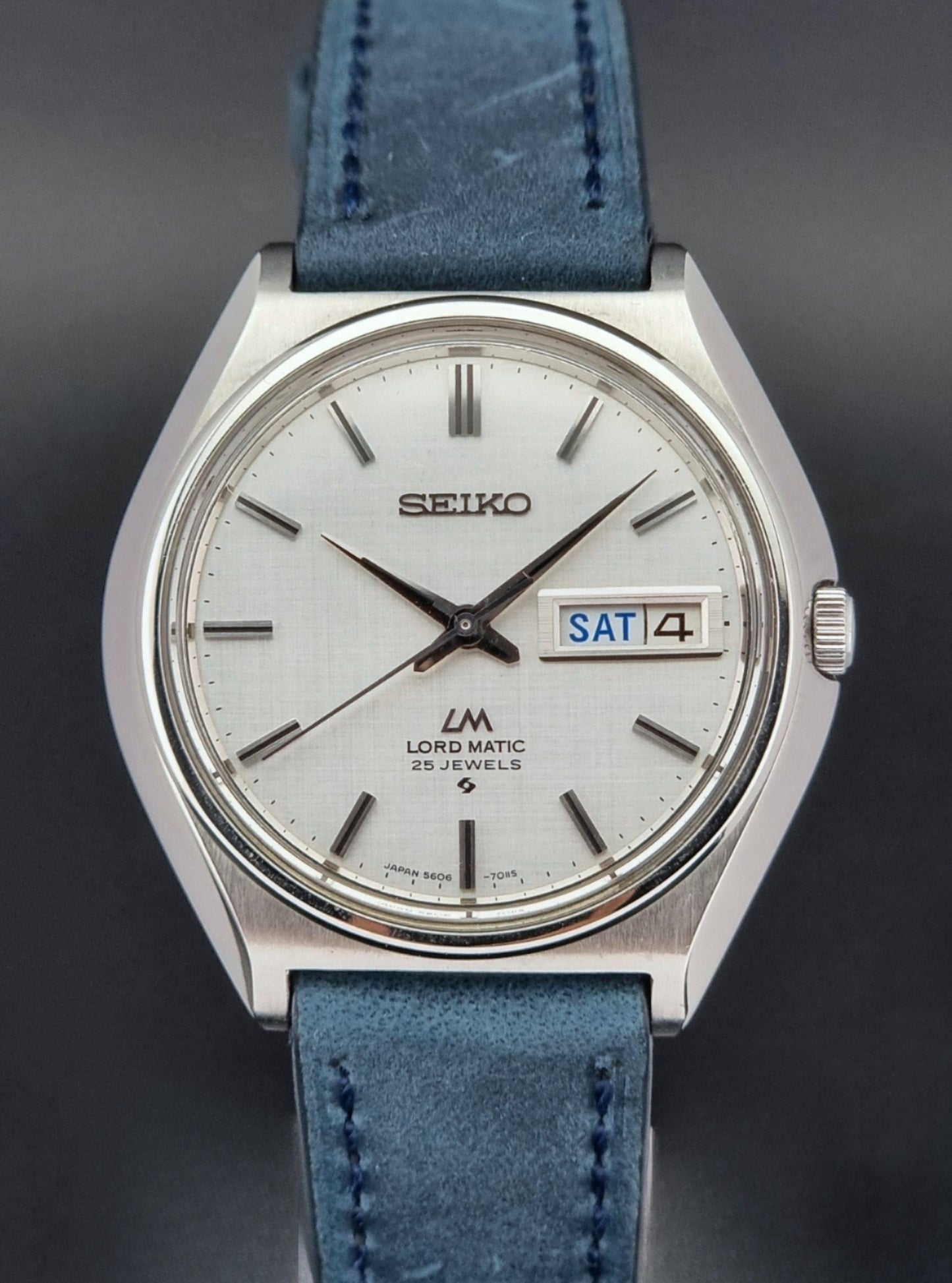 Vintage Seiko Wristwatch LordMatic 5606-7010 on a blue strap