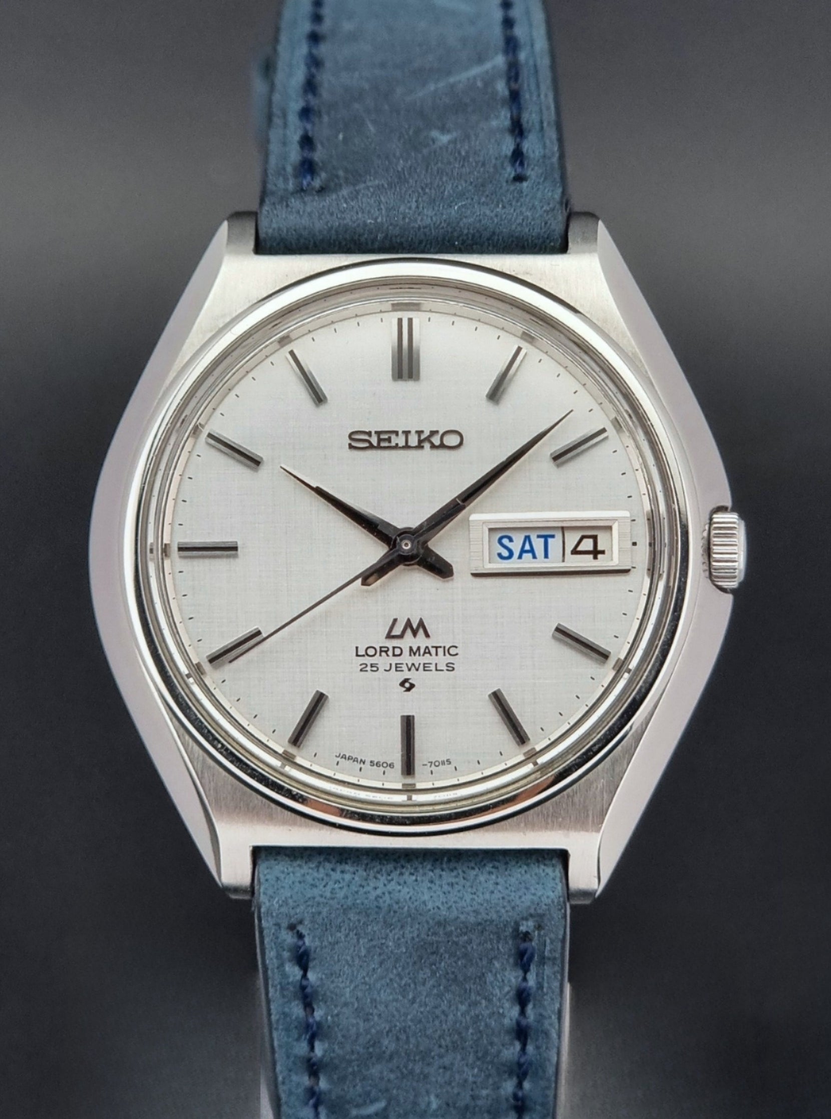 Vintage Seiko Wristwatch LordMatic 5606-7010 on a blue strap