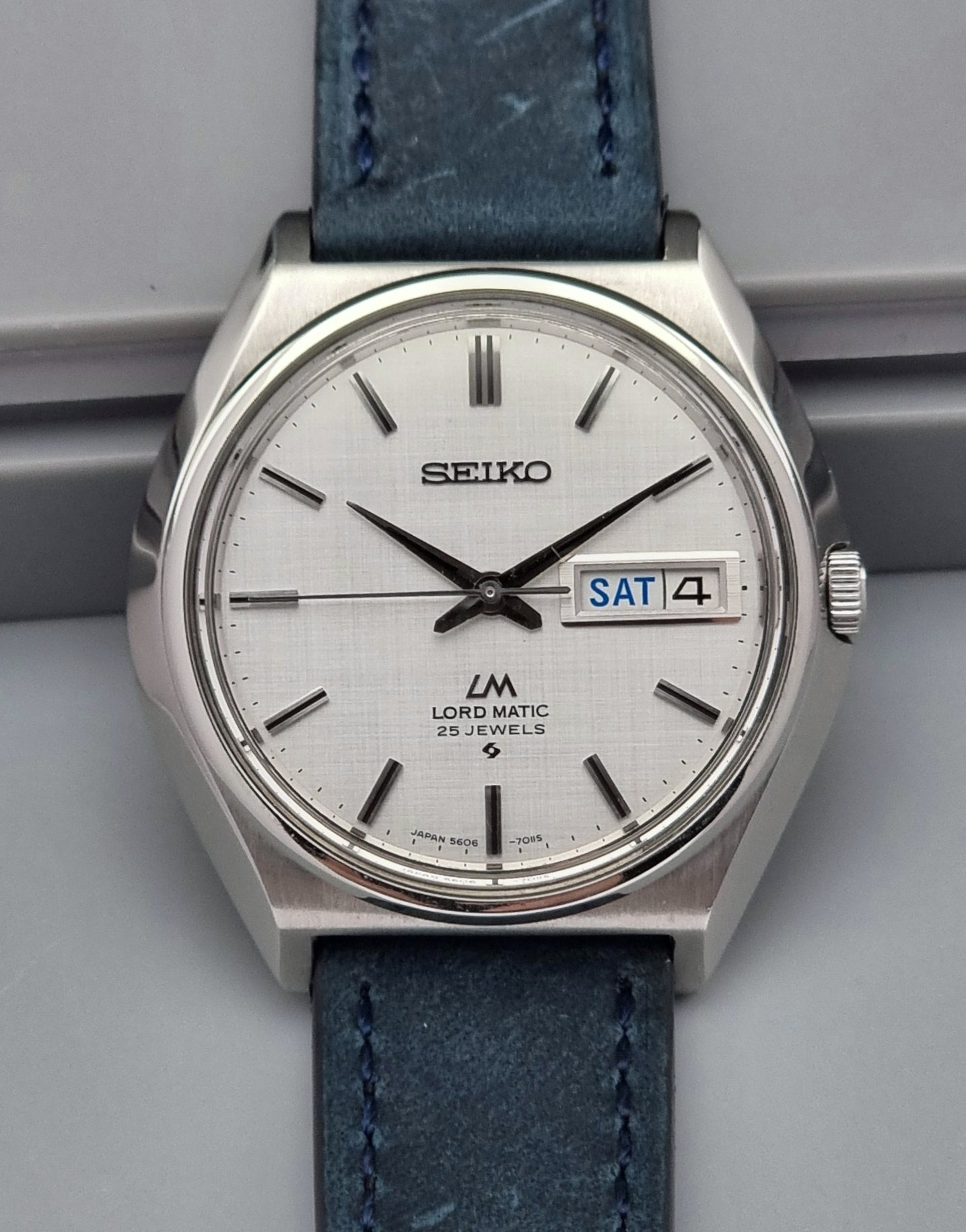 Vintage Seiko Wristwatch LordMatic 5606-7010 on a blue strap