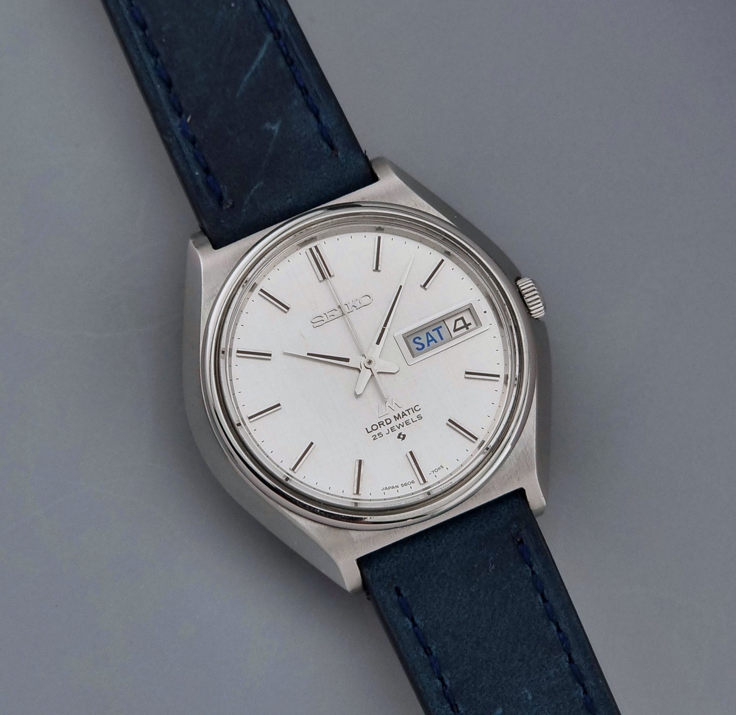 Vintage Seiko Wristwatch LordMatic 5606-7010 on a blue strap