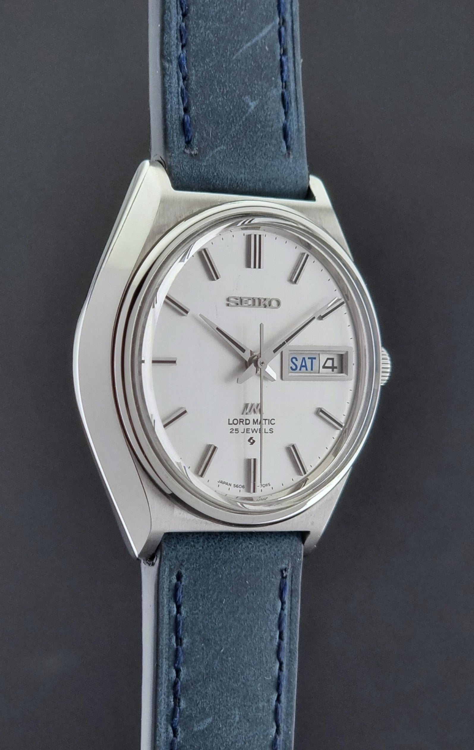 Vintage Seiko Wristwatch LordMatic 5606-7010 on a blue strap