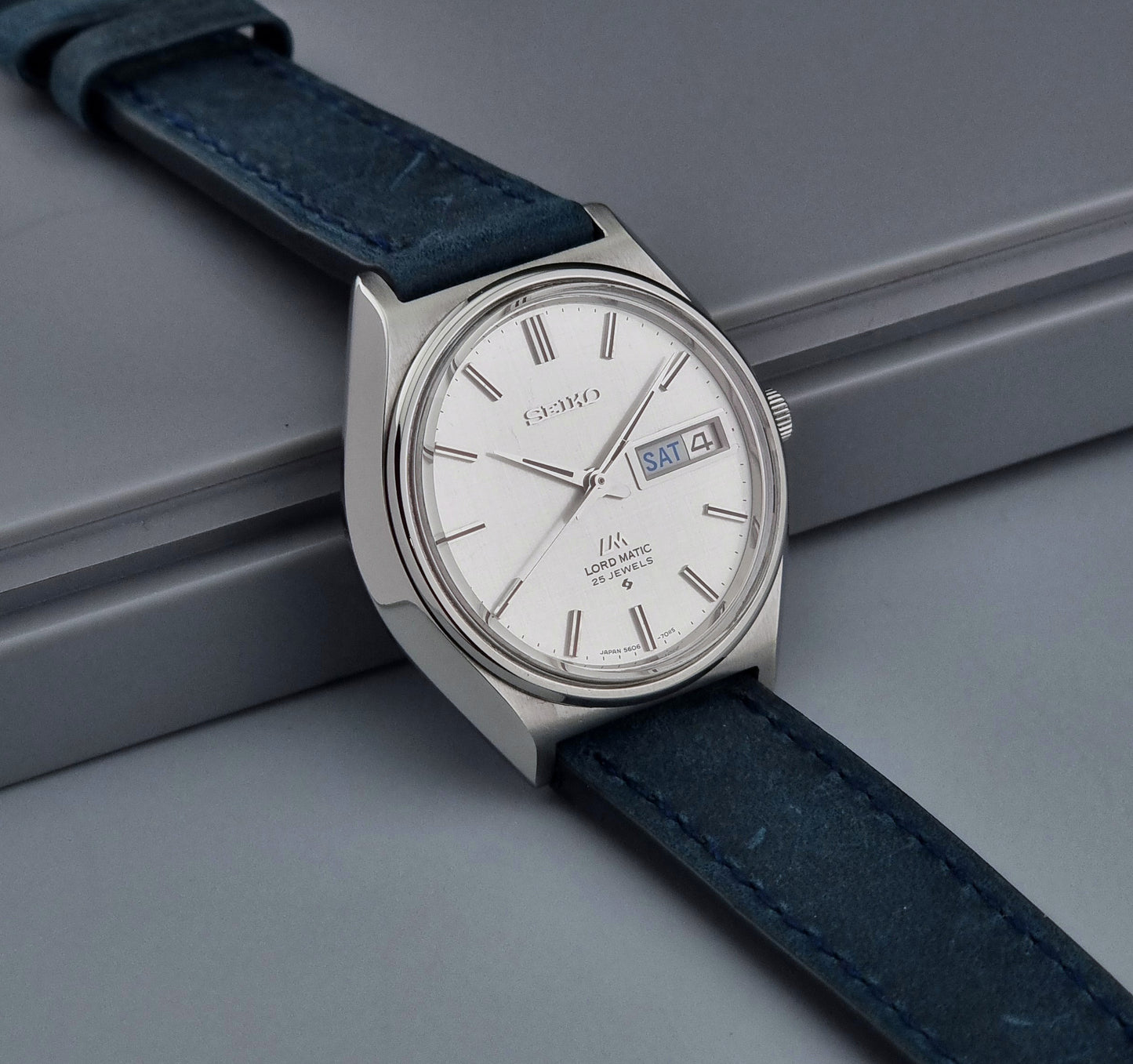 Vintage Seiko Wristwatch LordMatic 5606-7010 on a blue strap