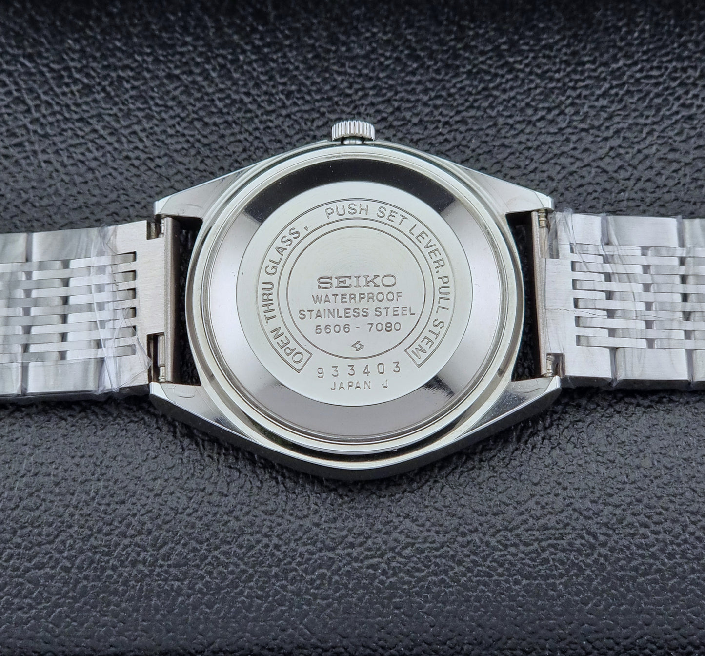 Seiko Wristwatch LordMatic 5606-7080  on a dark textured surface case back