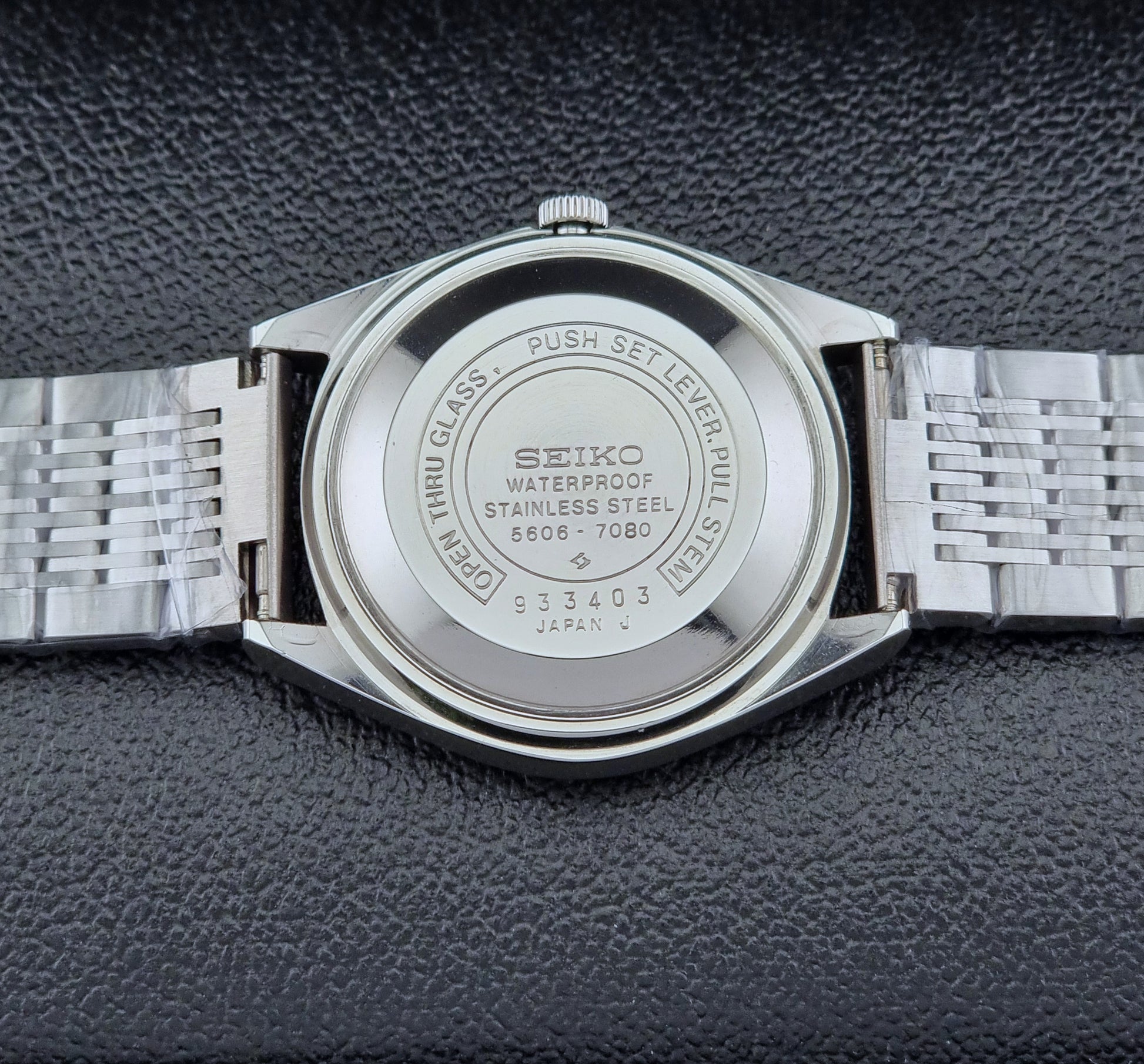 Seiko Wristwatch LordMatic 5606-7080  on a dark textured surface case back