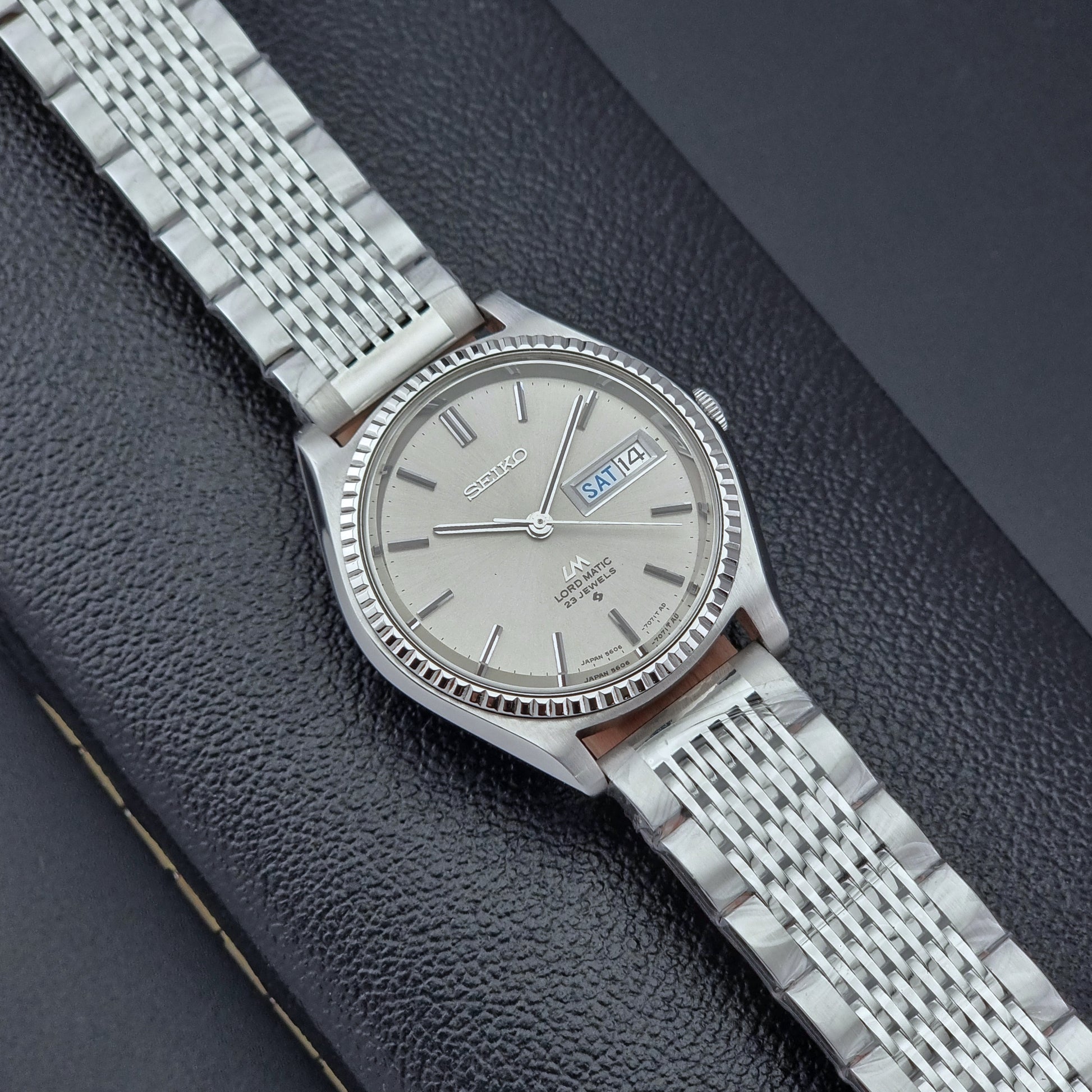 Seiko Wristwatch LordMatic 5606-7080  on a dark textured surface