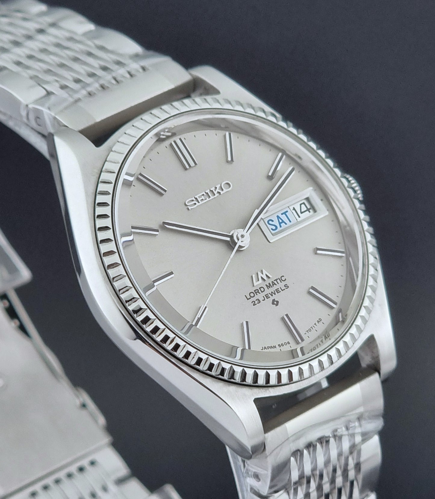 Seiko Wristwatch LordMatic 5606-7080  on a dark textured surface close up side profile