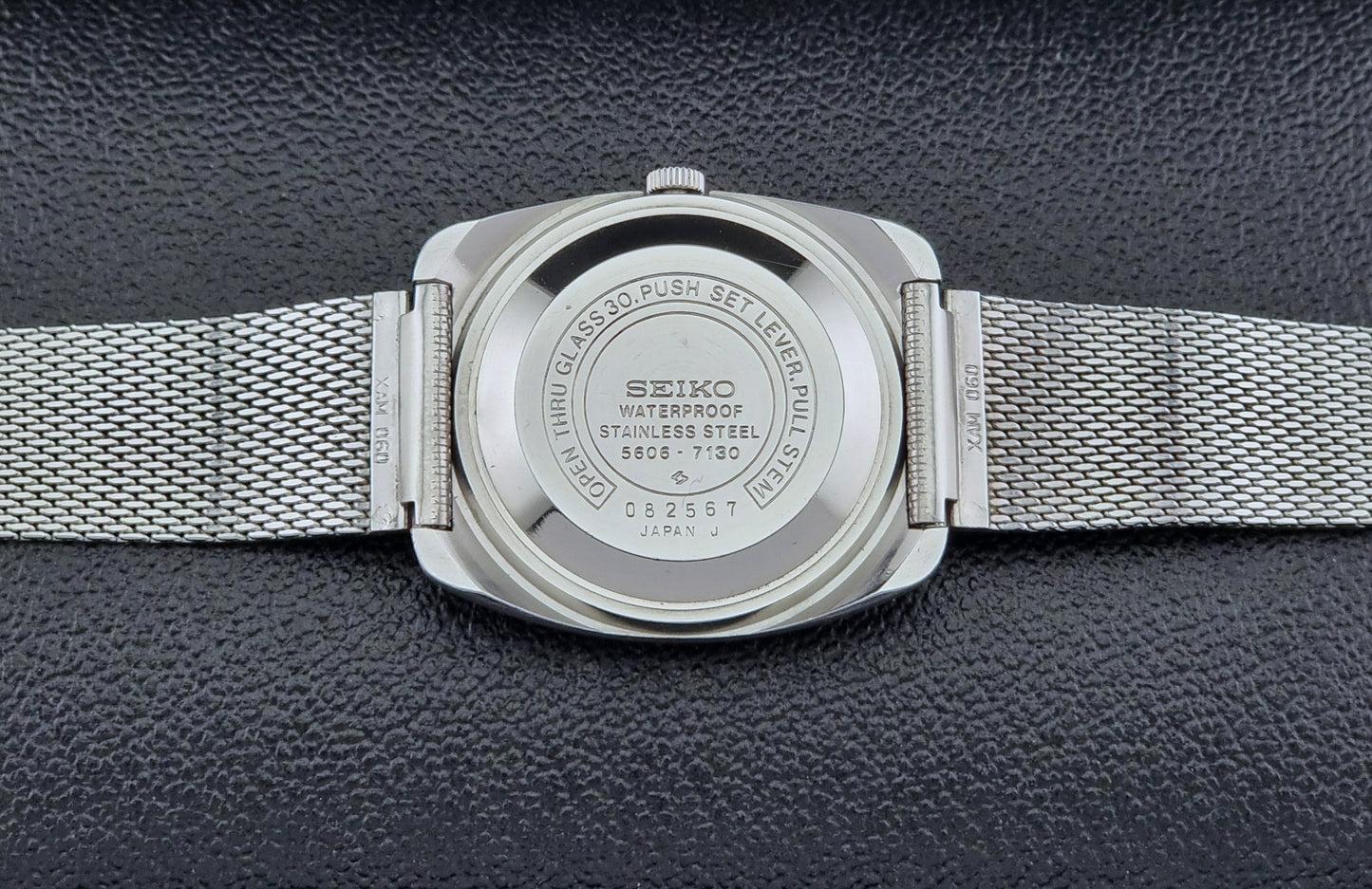 Vintage Seiko Lordmatic wristwatch on a dark background case back view