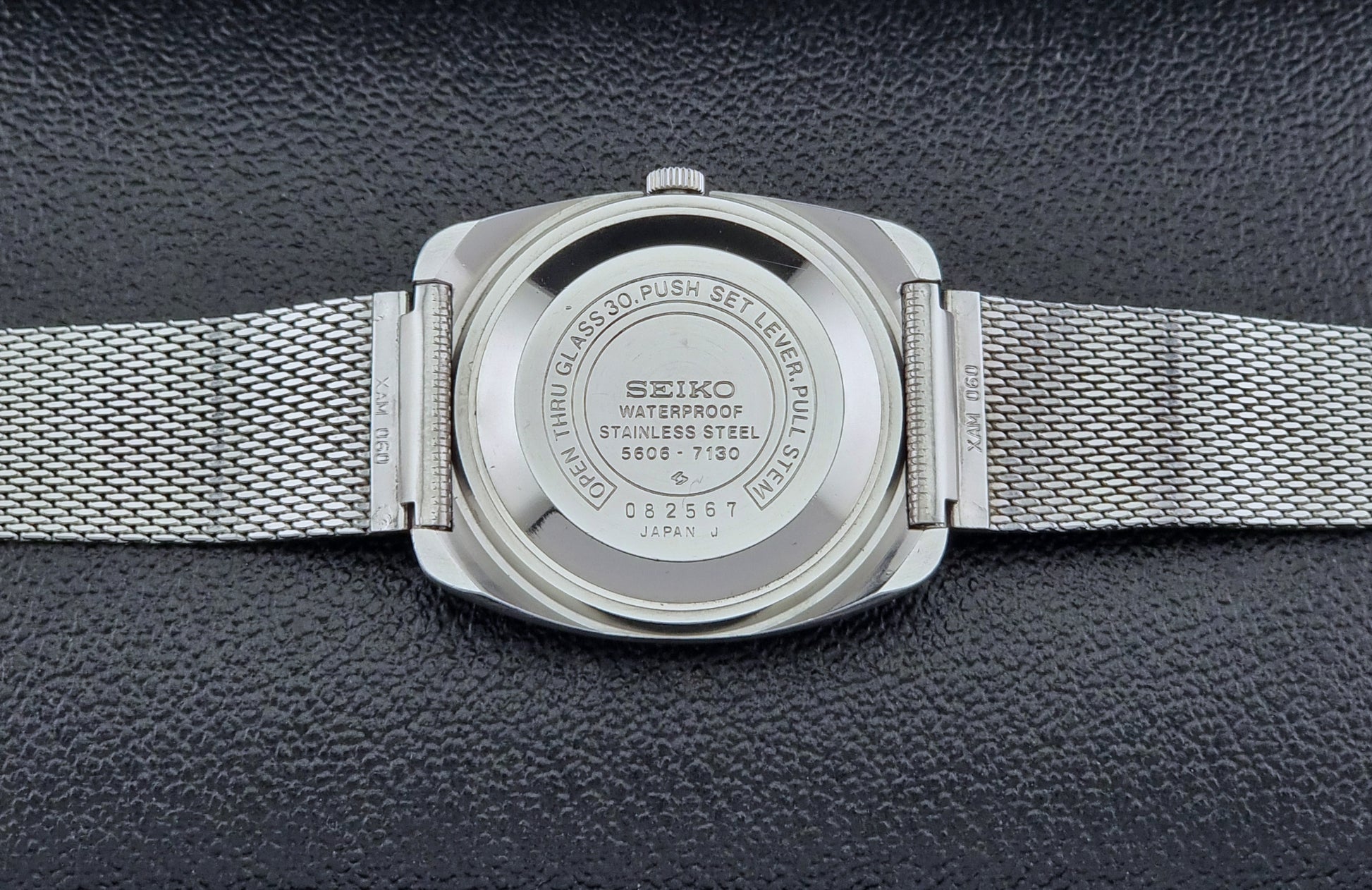 Vintage Seiko Lordmatic wristwatch on a dark background case back view