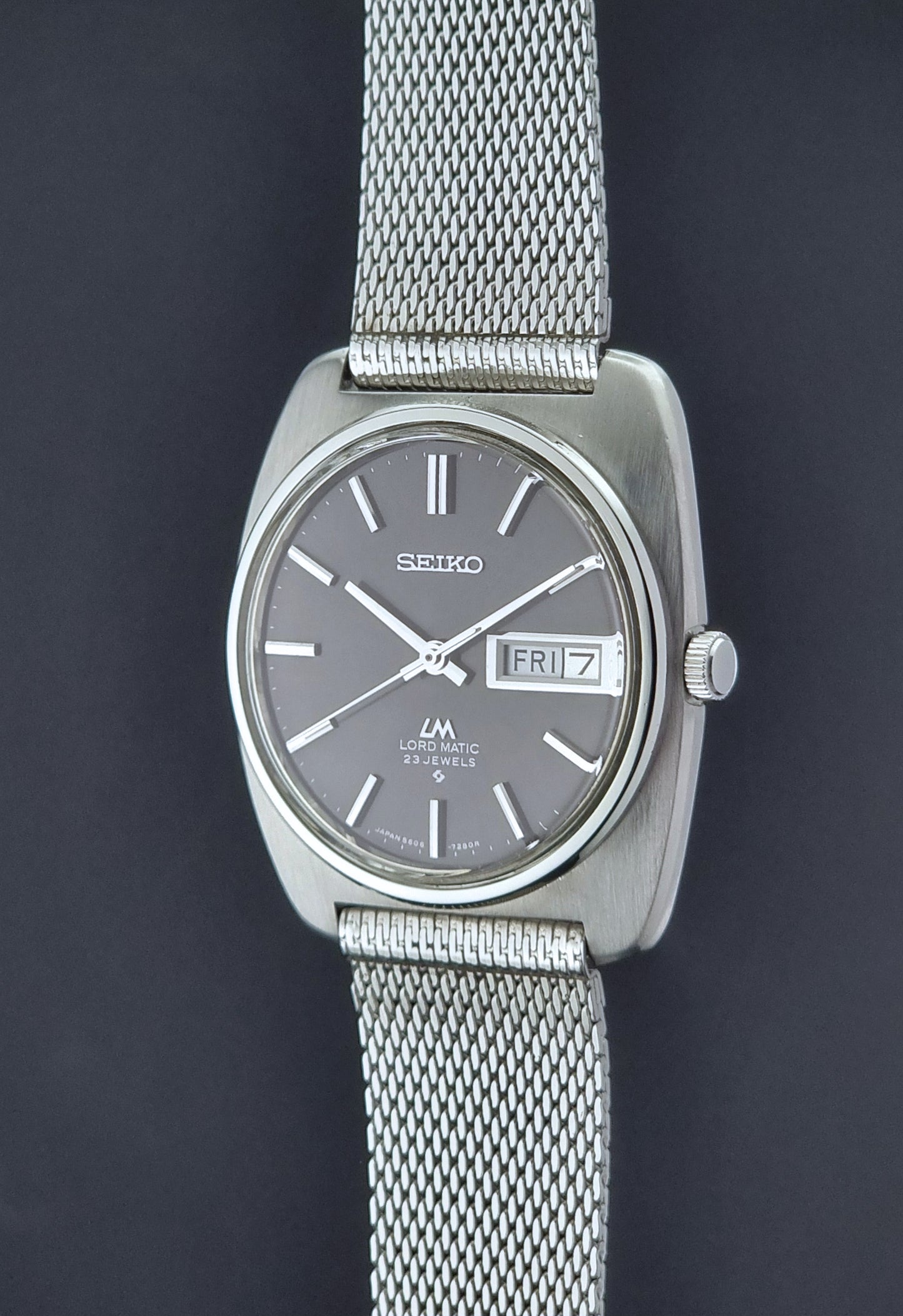 Vintage Seiko Lordmatic wristwatch on a dark background crown view