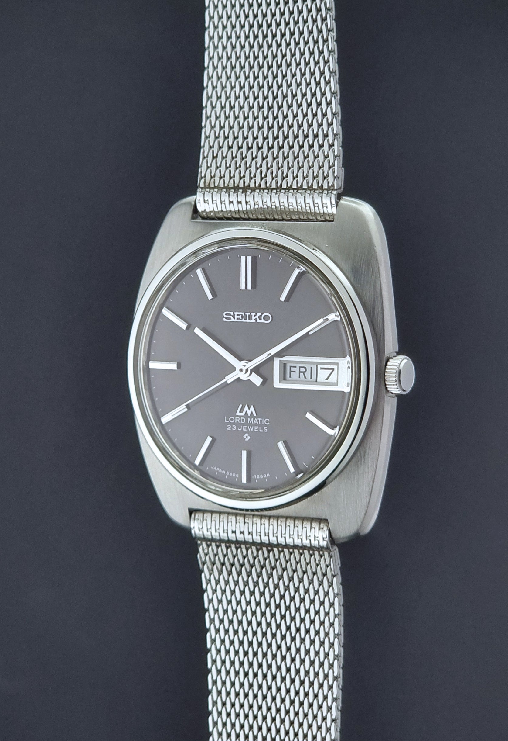 Vintage Seiko Lordmatic wristwatch on a dark background crown view