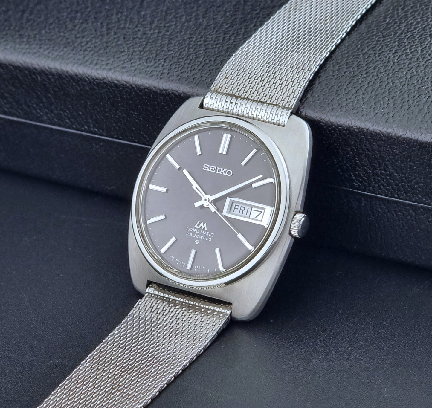 Vintage Seiko Lordmatic wristwatch on a dark background crown view