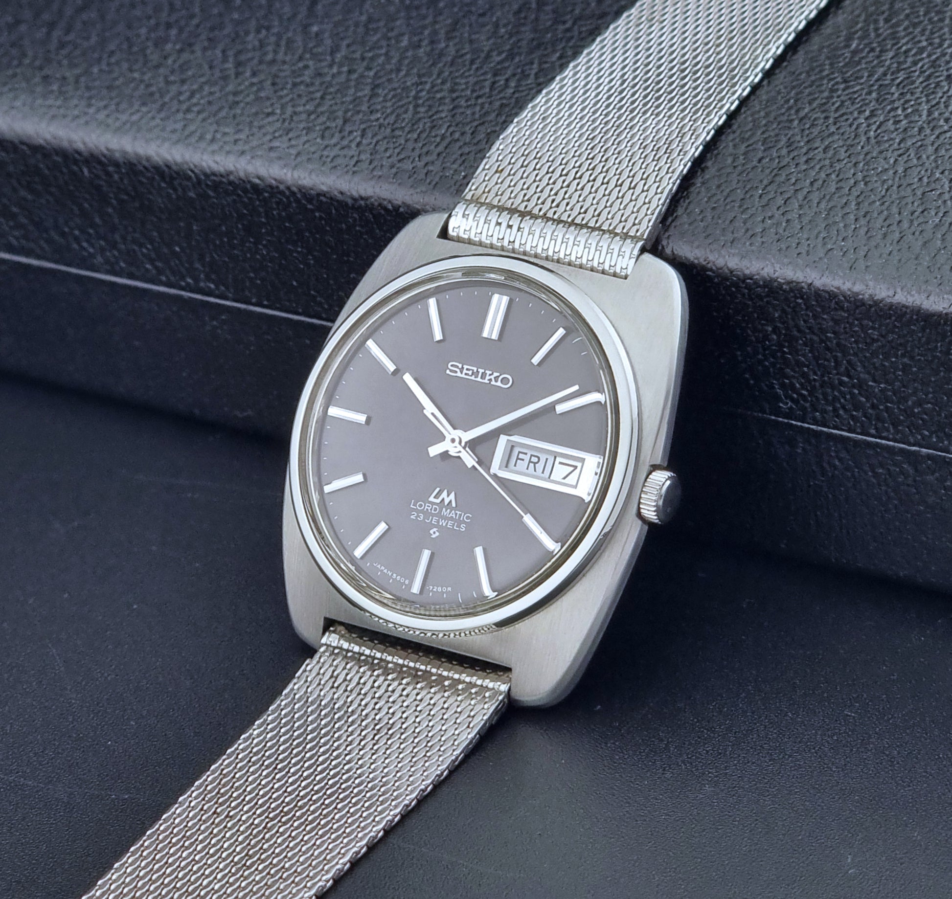 Vintage Seiko Lordmatic wristwatch on a dark background crown view