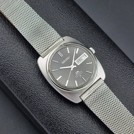 Vintage Seiko Lordmatic wristwatch on a dark background dial view