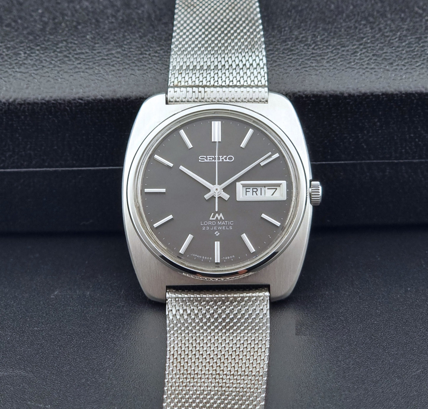 Vintage Seiko Lordmatic wristwatch on a dark background front view