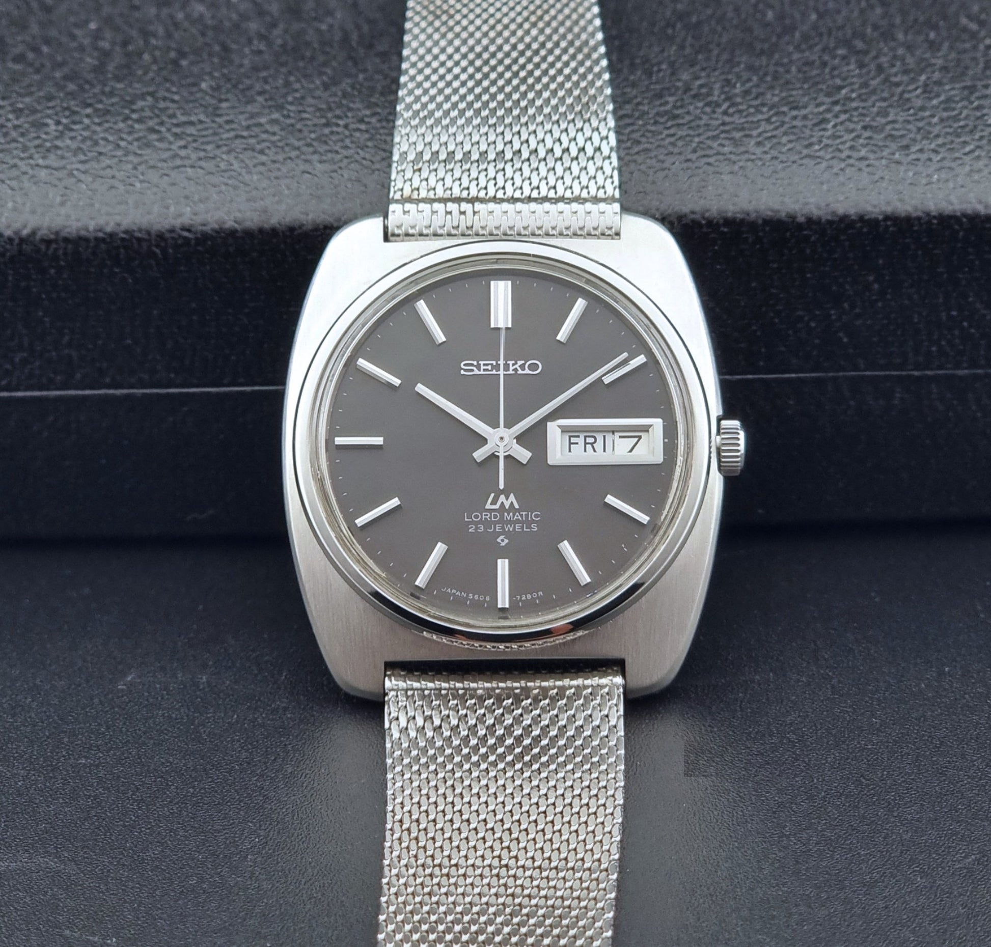 Vintage Seiko Lordmatic wristwatch on a dark background front view