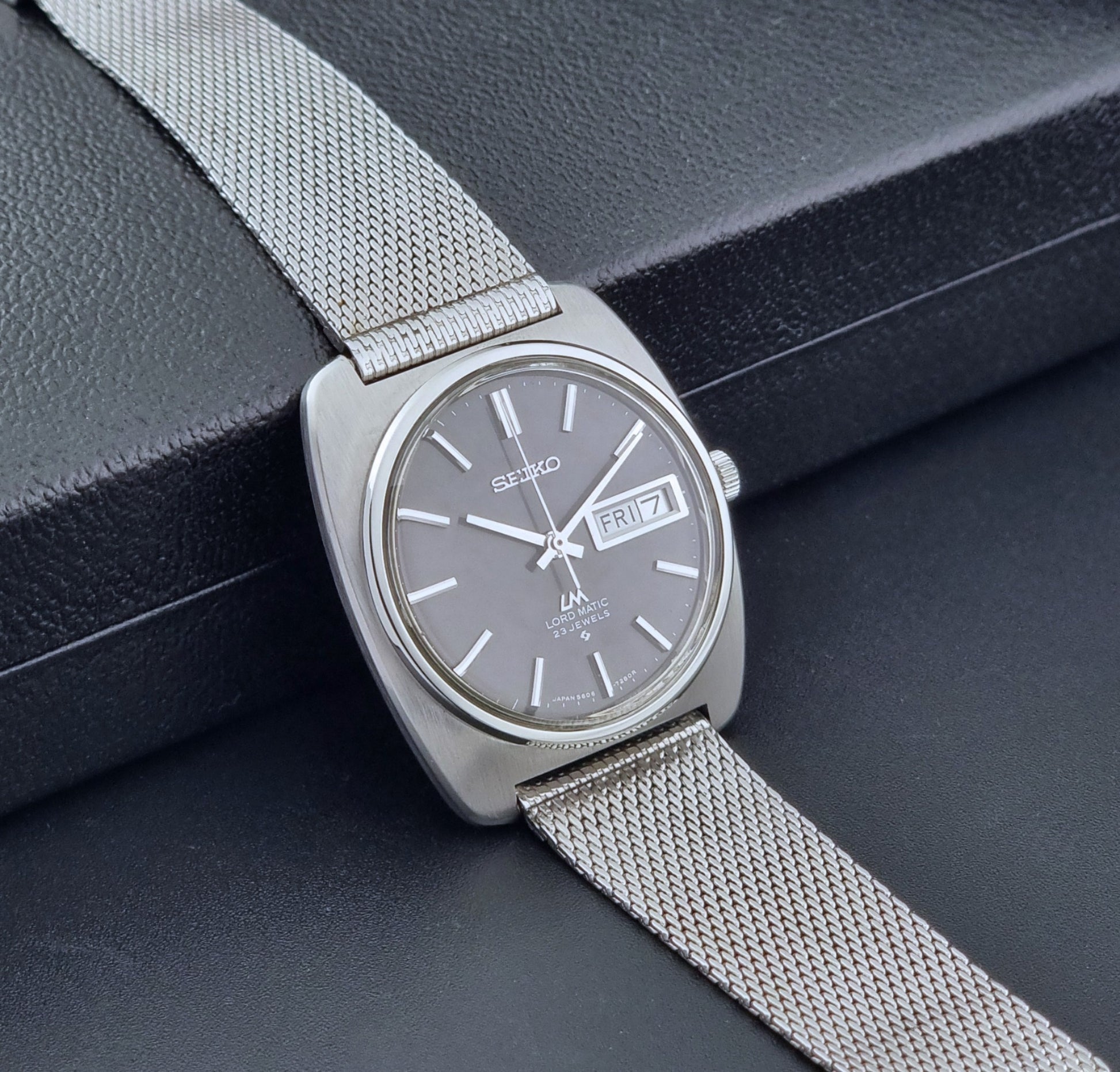 Vintage Seiko Lordmatic wristwatch on a dark background side view