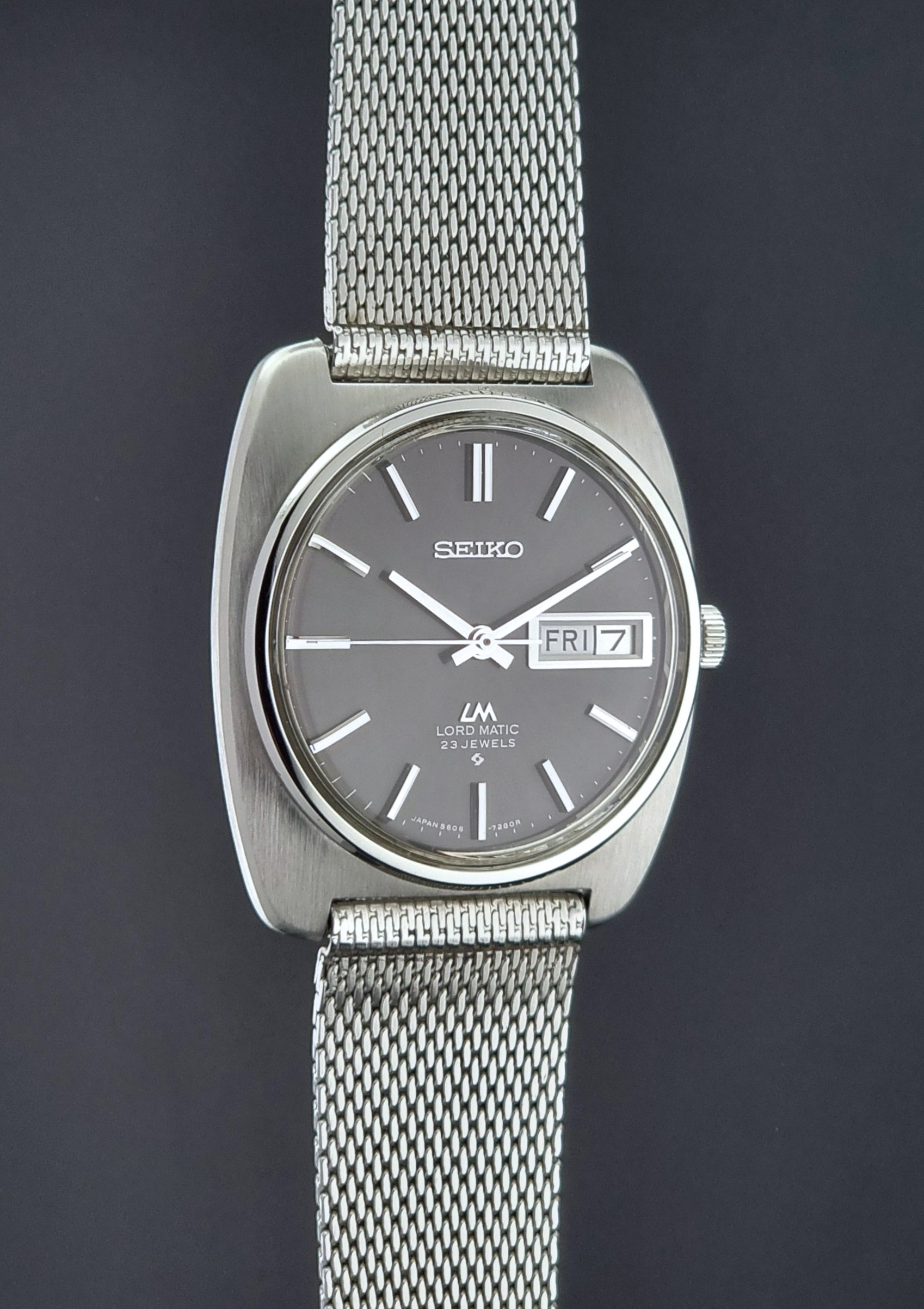 Vintage Seiko Lordmatic wristwatch on a dark background side profile 