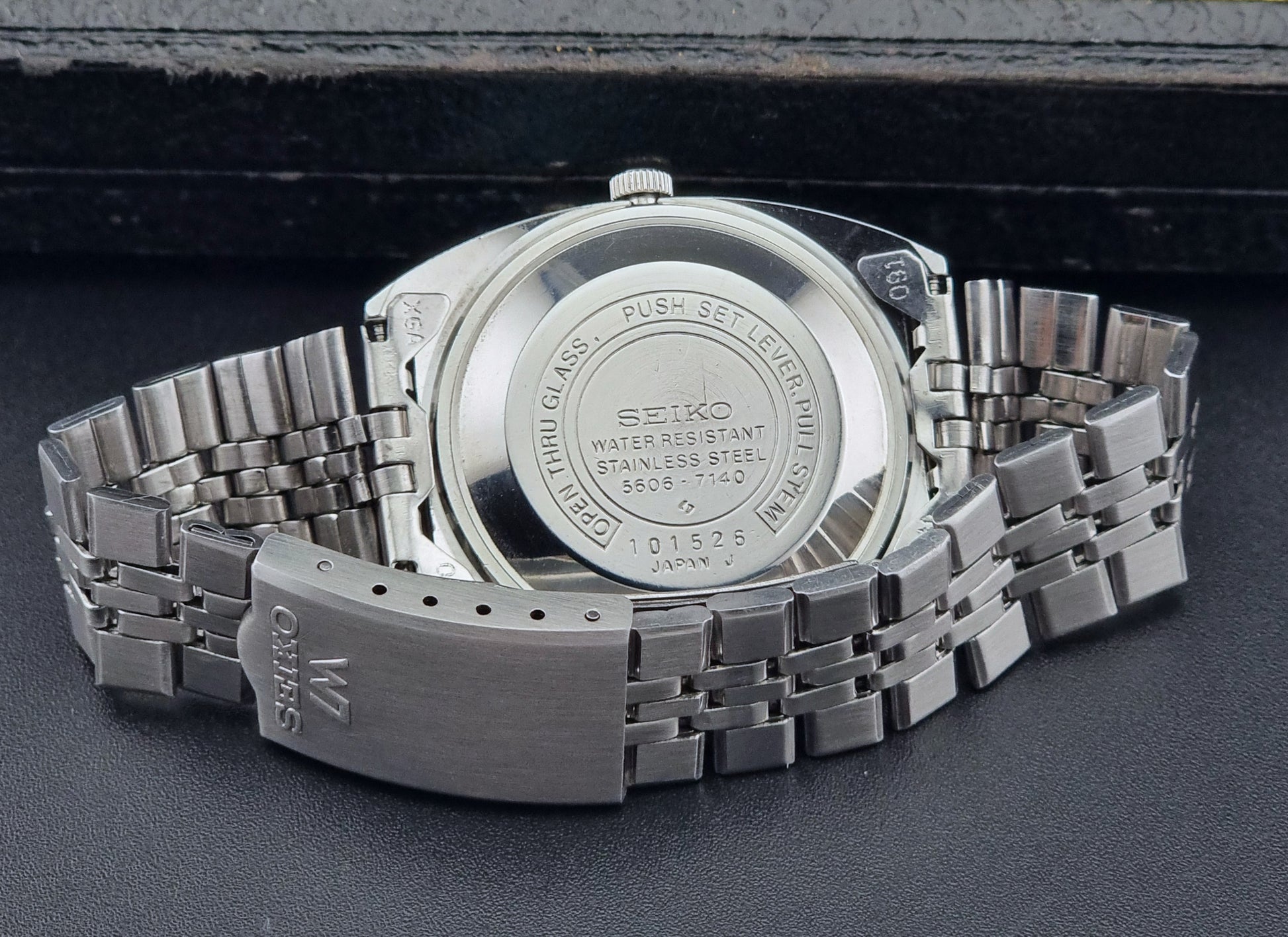 Vintage Seiko Lordmatic 5606-7140 watch on a dark background