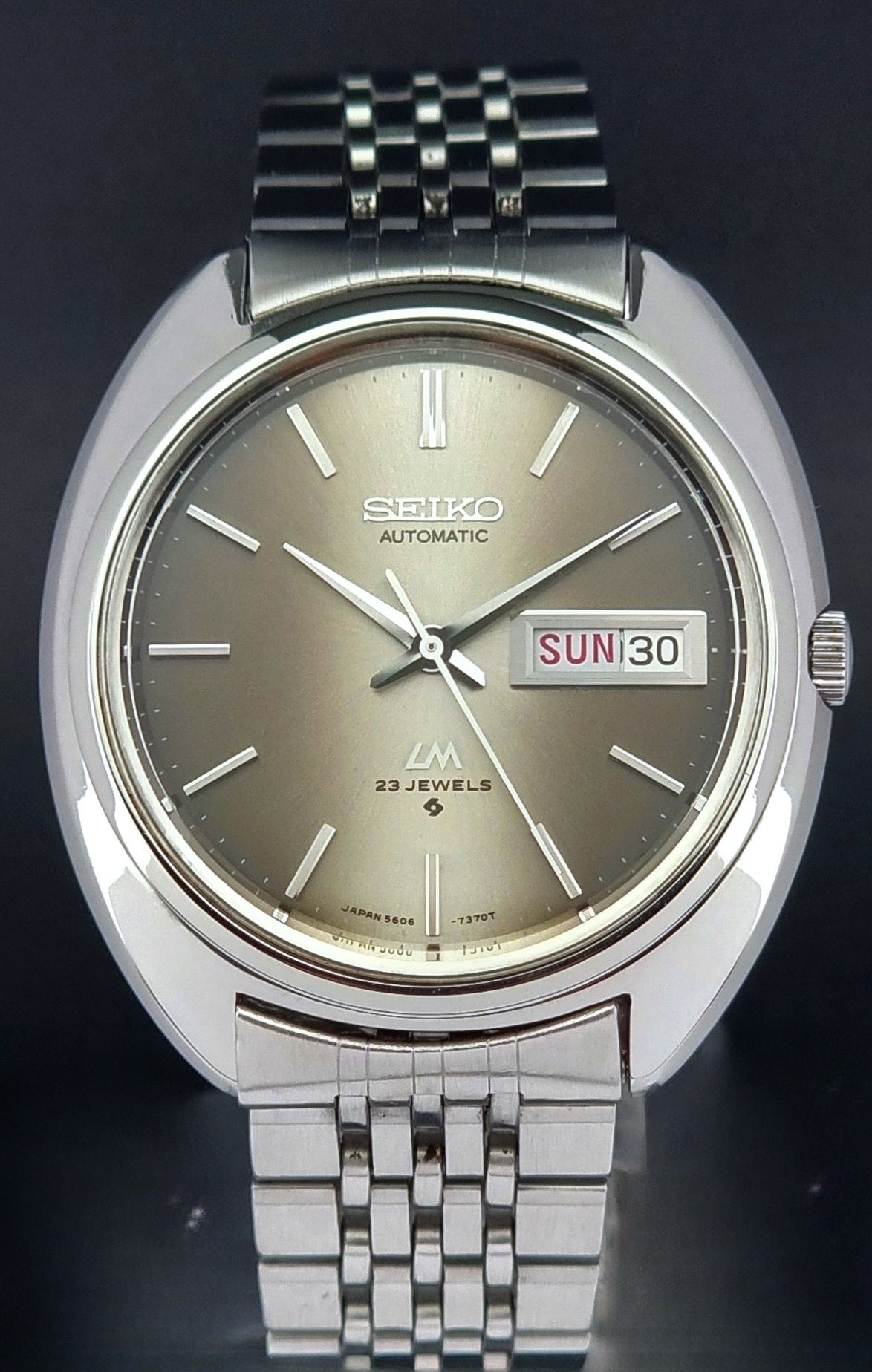 Vintage Seiko Lord Matic watch with a brown face on a dark background