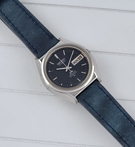 Vintage Seiko watch LordMatic Special 5206-6080 with blue strap and dark blue dial on a surface dial