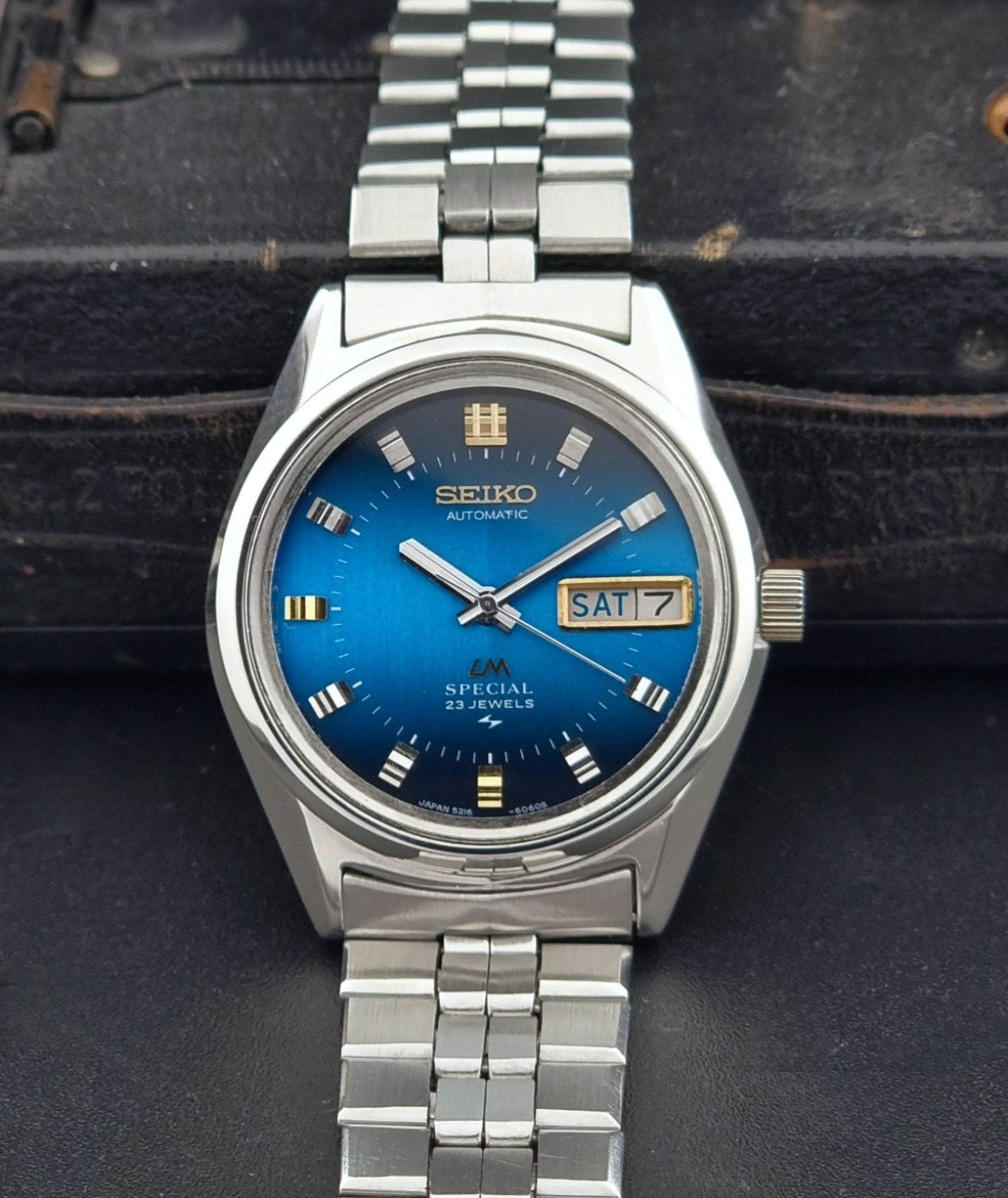 Vintage Seiko Wristwatch LordMatic Special 5216-6050 with blue dial on a dark background front view