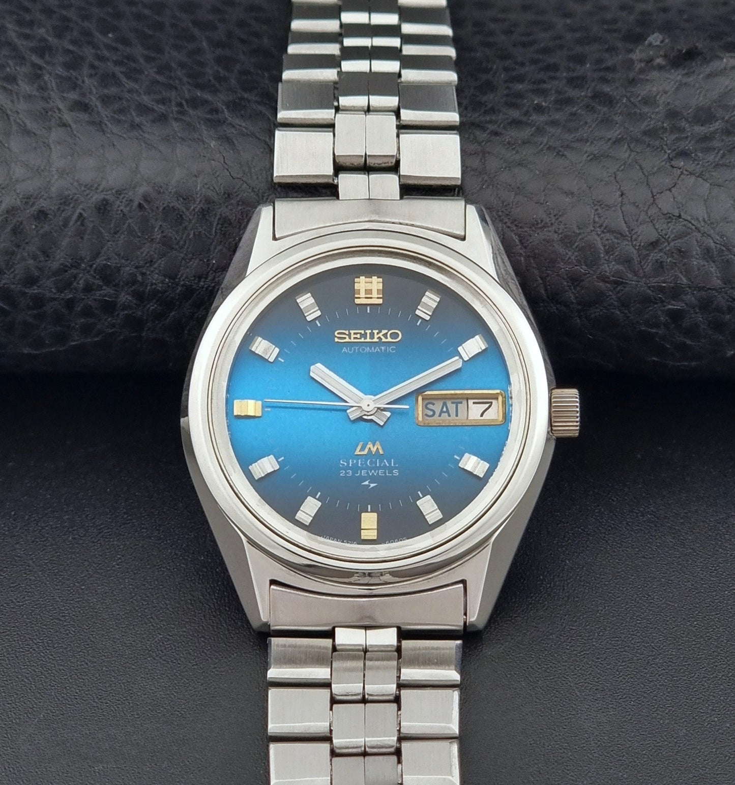 Vintage Seiko Wristwatch LordMatic Special 5216-6050 with blue dial on a dark background dial view