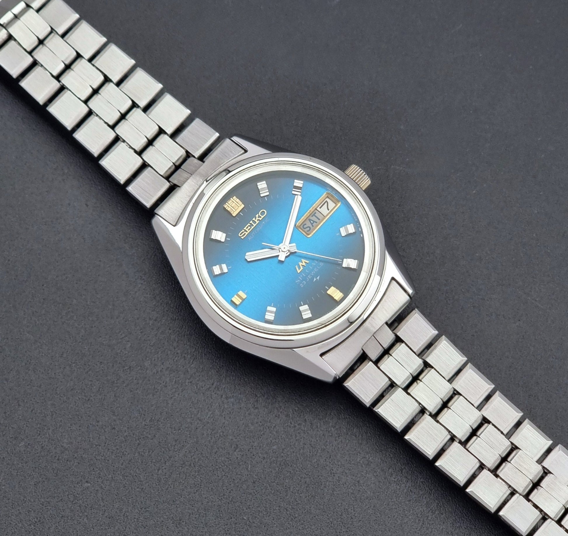 Vintage Seiko Wristwatch LordMatic Special 5216-6050 with blue dial on a dark background dial