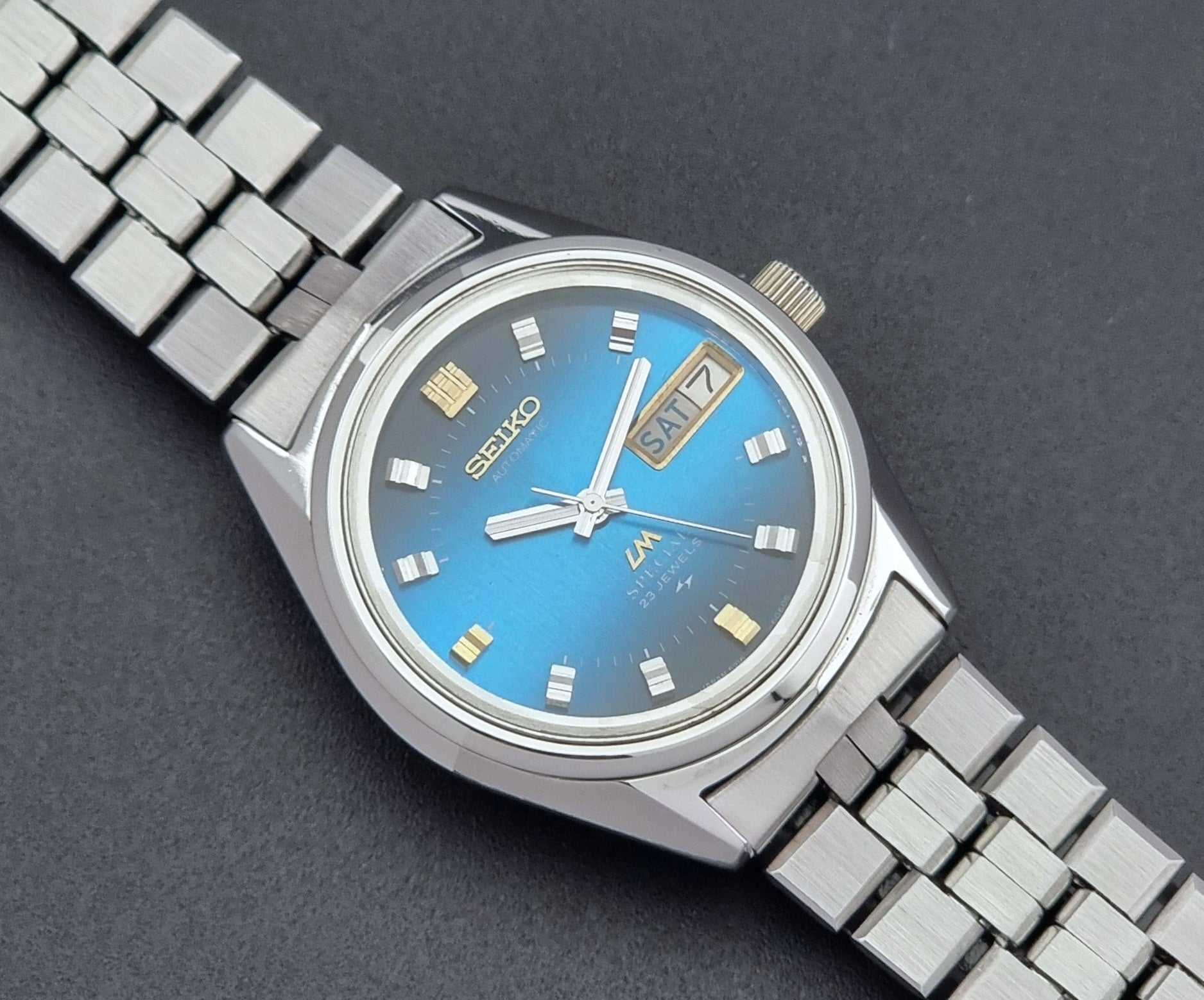 Vintage Seiko Wristwatch LordMatic Special 5216-6050 with blue dial on a dark background close up dial view