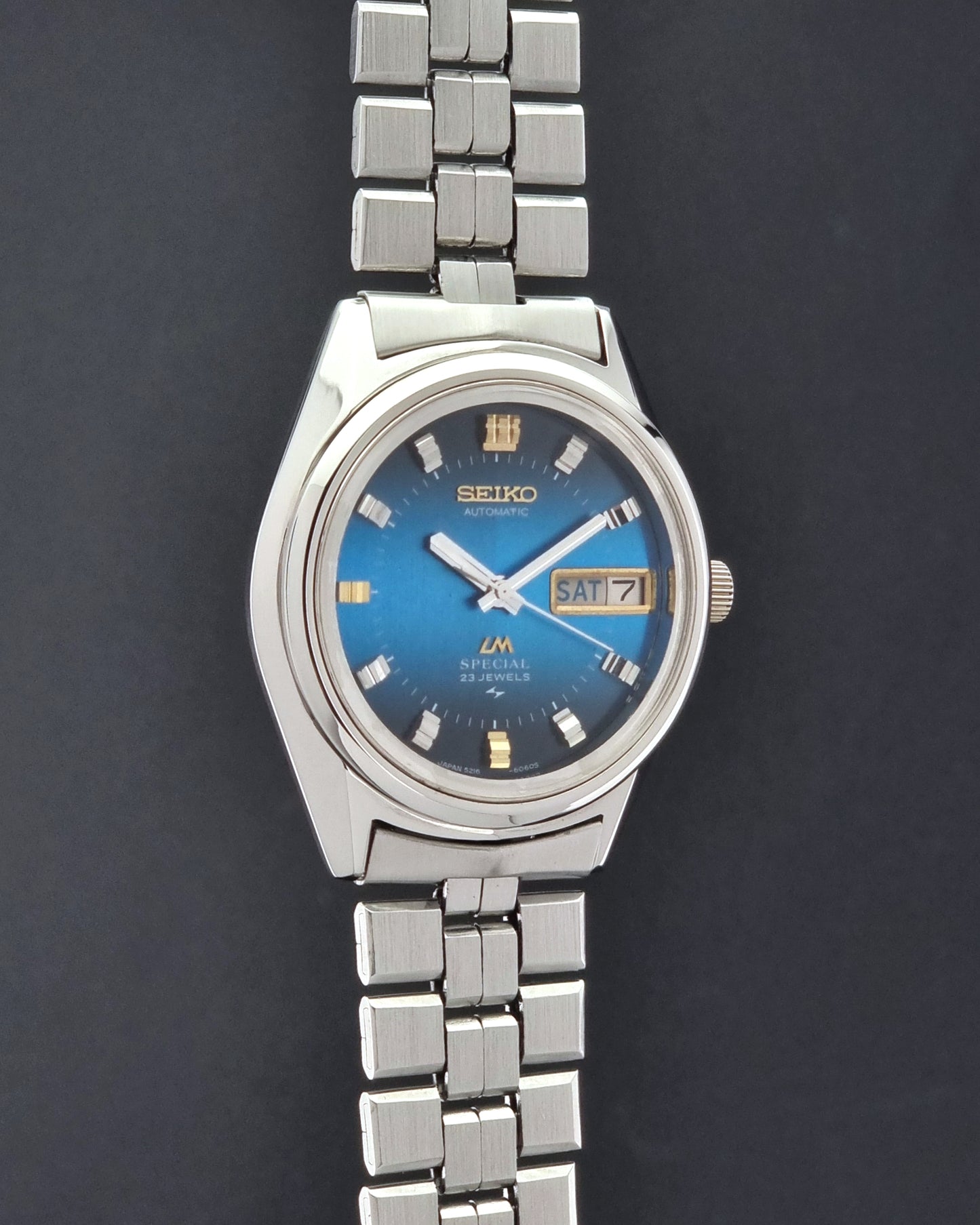 Vintage Seiko Wristwatch LordMatic Special 5216-6050 with blue dial on a dark background side profile view