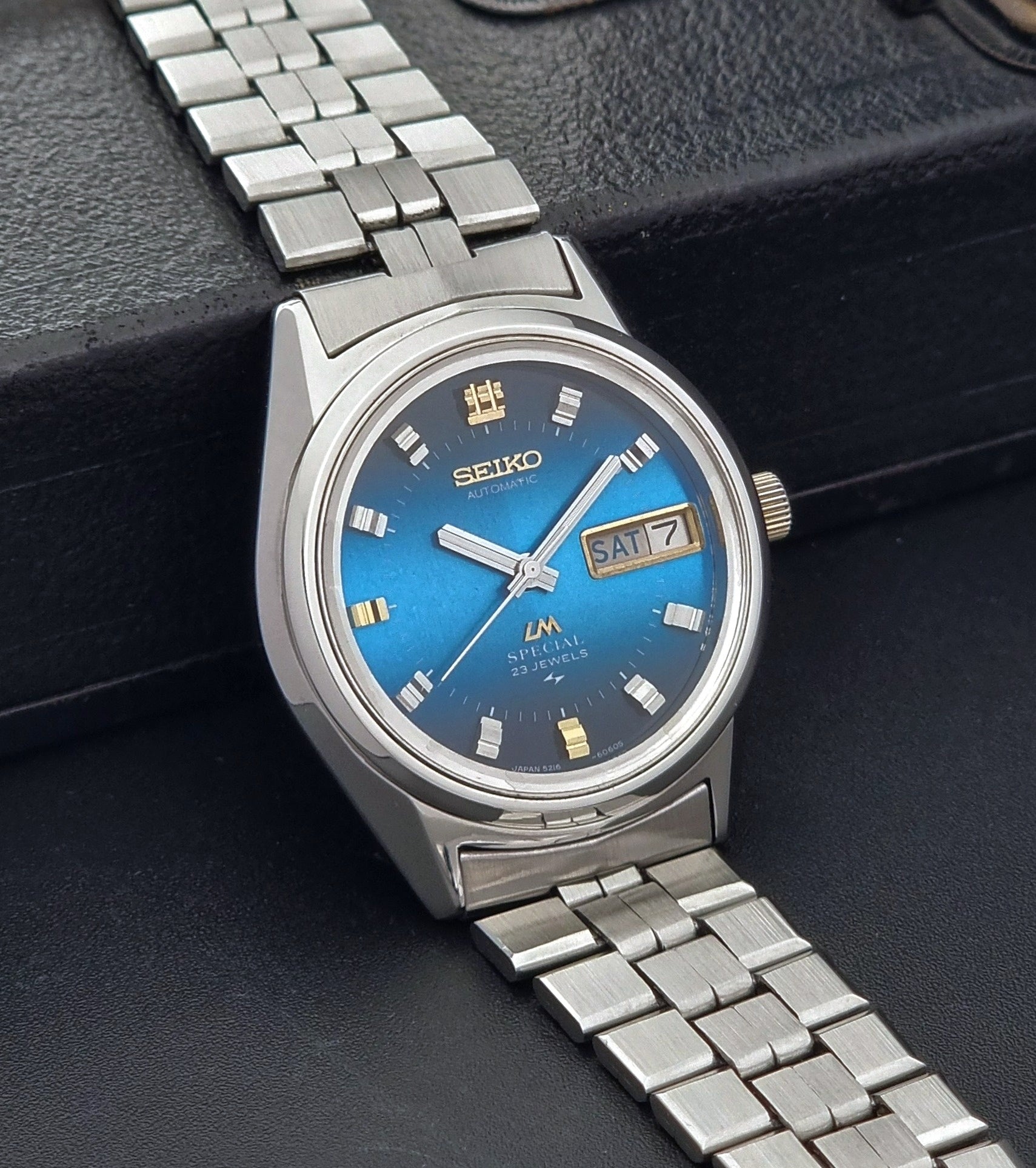 Vintage Seiko Wristwatch LordMatic Special 5216-6050 with blue dial on a dark background side view