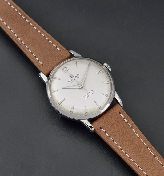 Vintage Seiko Marvel J14004 watch with a brown leather strap on a dark background dial