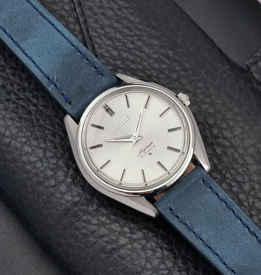Seiko Skyliner 6100-8000 Watch with blue strap on a textured black surface